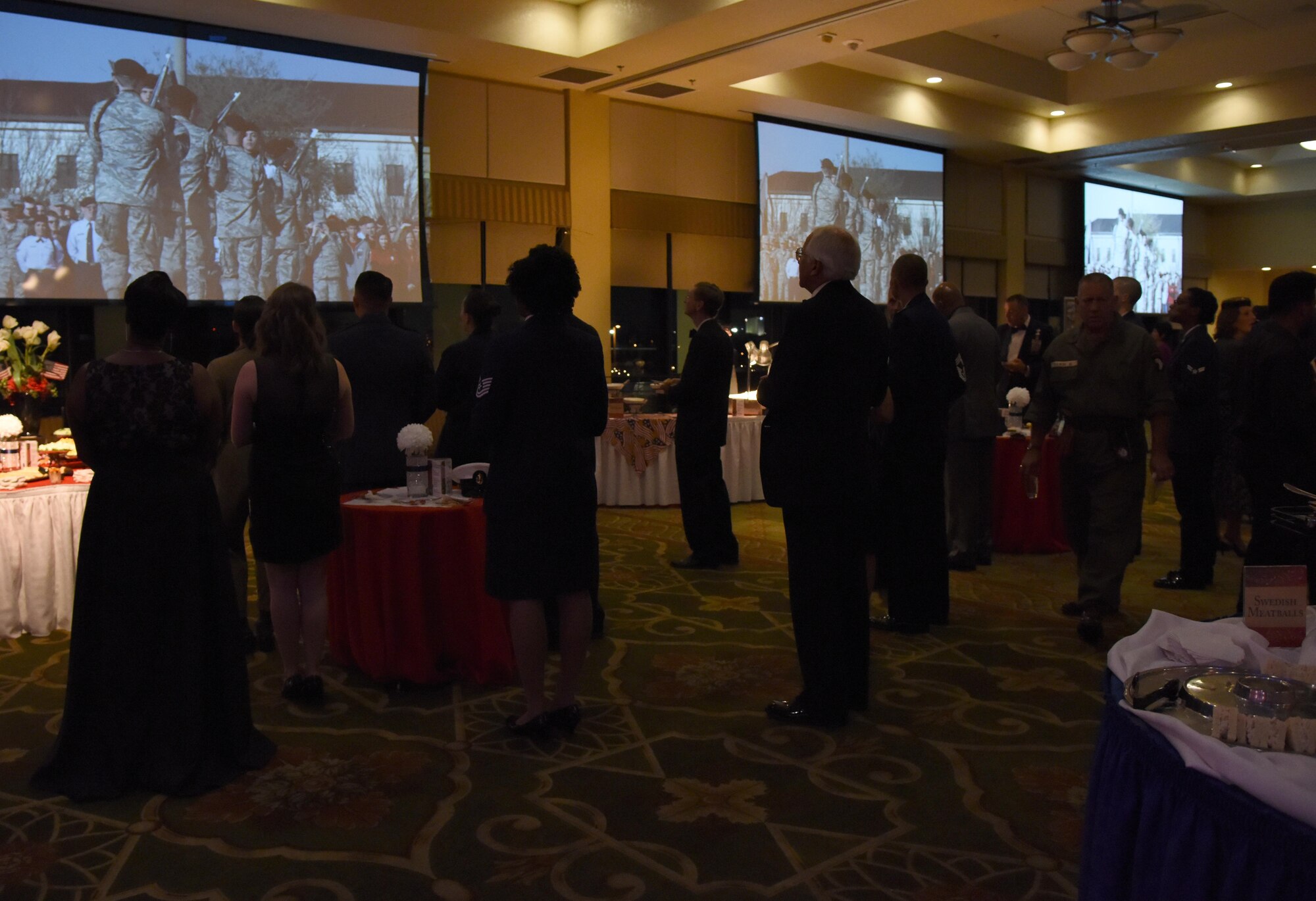 Keesler personnel and guests watch a video during the installation’s 75th Anniversary Gala at the Bay Breeze Event Center Nov. 4, 2016, on Keesler Air Force Base, Miss. The celebration commemorated Keesler’s 75 years of history with historical displays, throwback trivia, musical and dance performances and recognition of family members of Lt. Samuel Keesler, Jr. (U.S. Air Force photo by Kemberly Groue/Released)