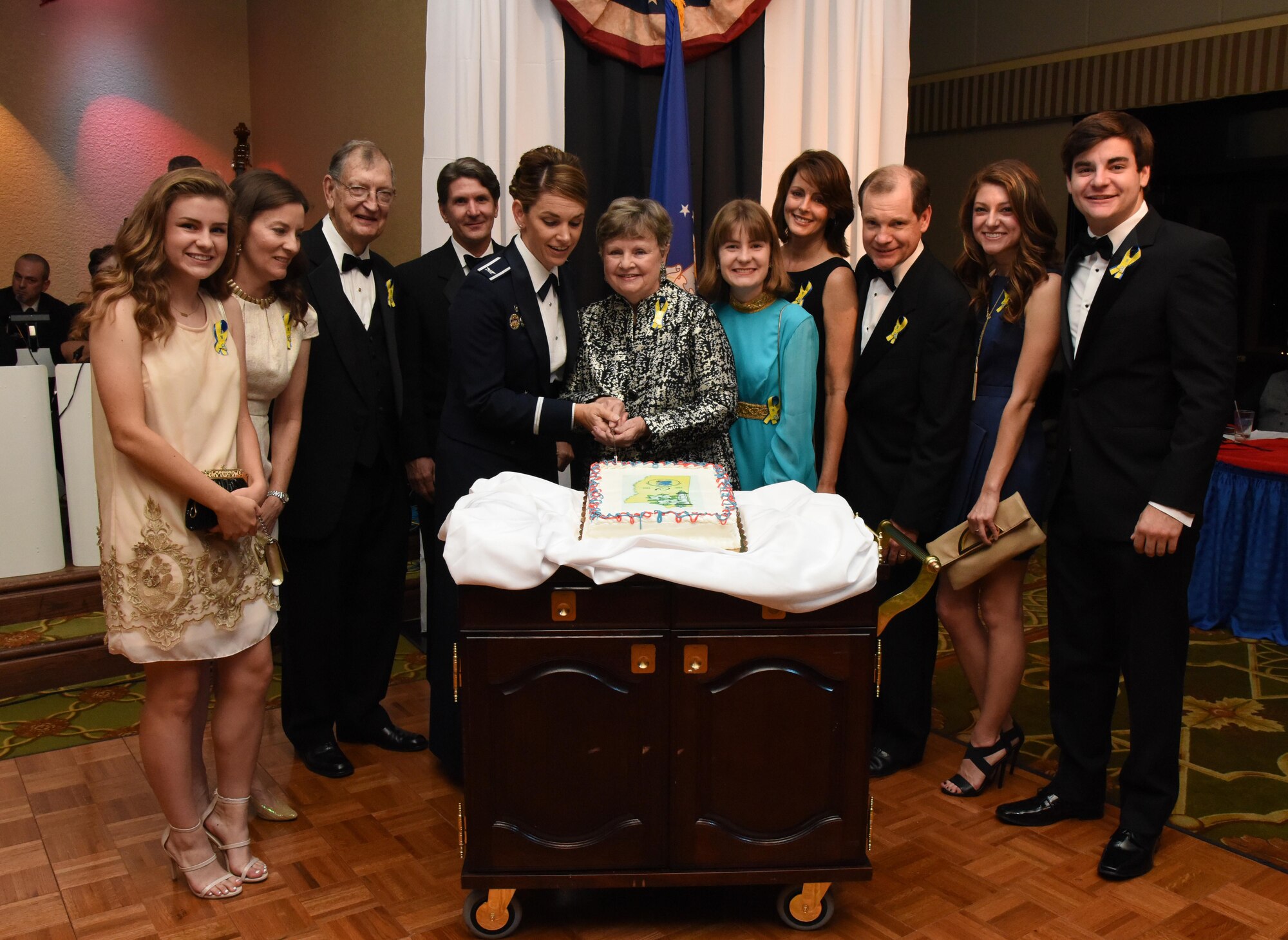 Col. Michele Edmondson, 81st Training Wing commander, participates in a cake cutting ceremony with family members of Lt. Samuel Keesler, Jr., during the installation’s 75th Anniversary Gala at the Bay Breeze Event Center Nov. 4, 2016, on Keesler Air Force Base, Miss. The celebration commemorated Keesler’s 75 years of history with historical displays, throwback trivia and musical and dance performances. (U.S. Air Force photo by Kemberly Groue/Released)
