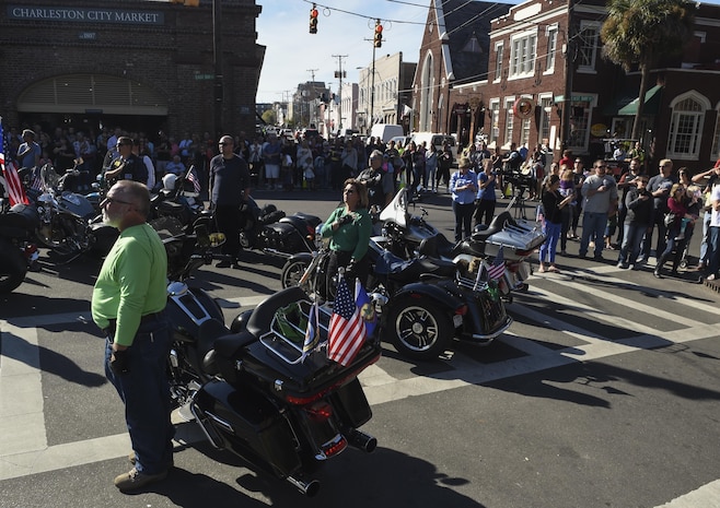 Charleston community members stand for the singing of the national anthem during the Veterans Day parade in Charleston, South Carolina, Oct. 6, 2016. The parade began at the intersection of Market and East Bay Streets and ended at the Ralph H. Johnson Veterans Affairs Medical Center.