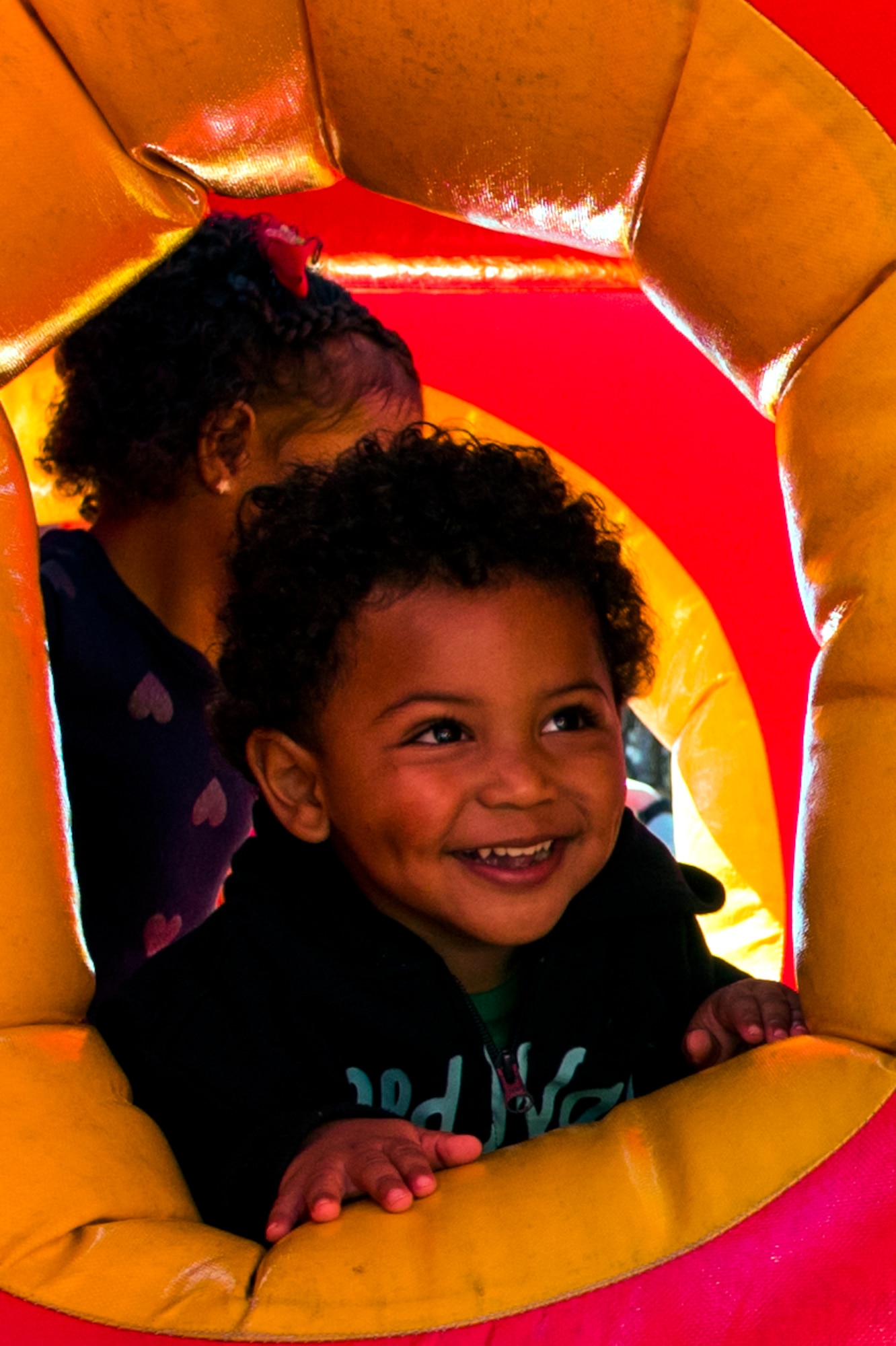 The son of Tech. Sgt. Renata Garcia, 4th Force Support Squadron career development, plays in a bounce house during the annual Military Family Appreciation event, Nov. 5, 2016, at Seymour Johnson Air Force Base, North Carolina. The annual event is held to honor family members who face unique difficulties and challenges associated with military life. (U.S. Air Force photo by Airman Shawna L. Keyes)