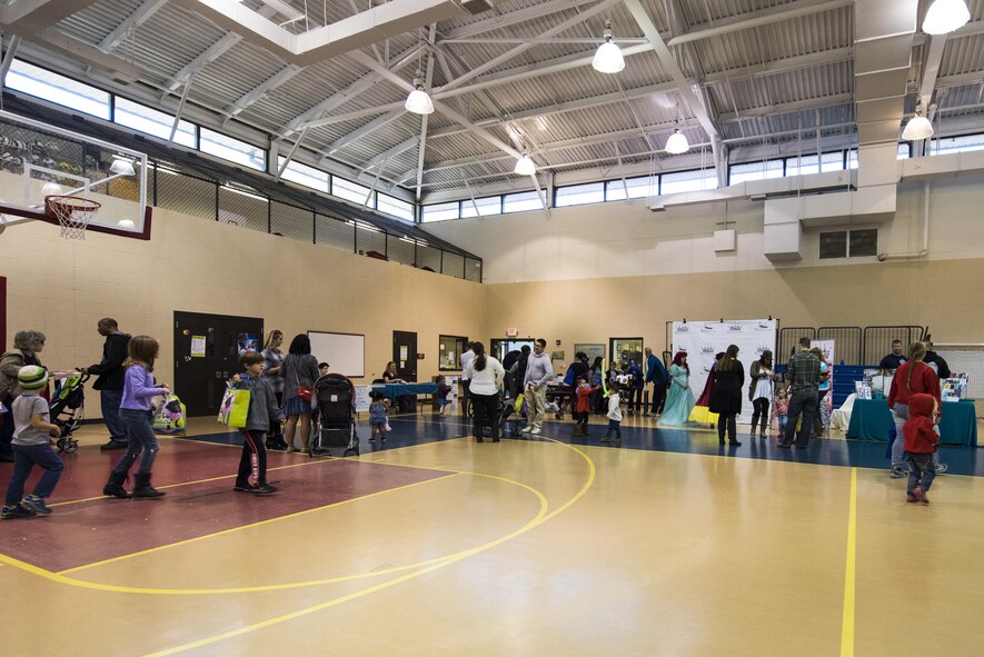 Members of Team Seymour visit various booths of helping agencies during an annual Military Family Appreciation event, Nov. 5, 2016, at Seymour Johnson Air Force Base, North Carolina. Airmen Against Drunk Driving, Military OneSource, the Health and Wellness Center, along with multiple local businesses educated families about available services. (U.S. Air Force photo by Airman Shawna L. Keyes)