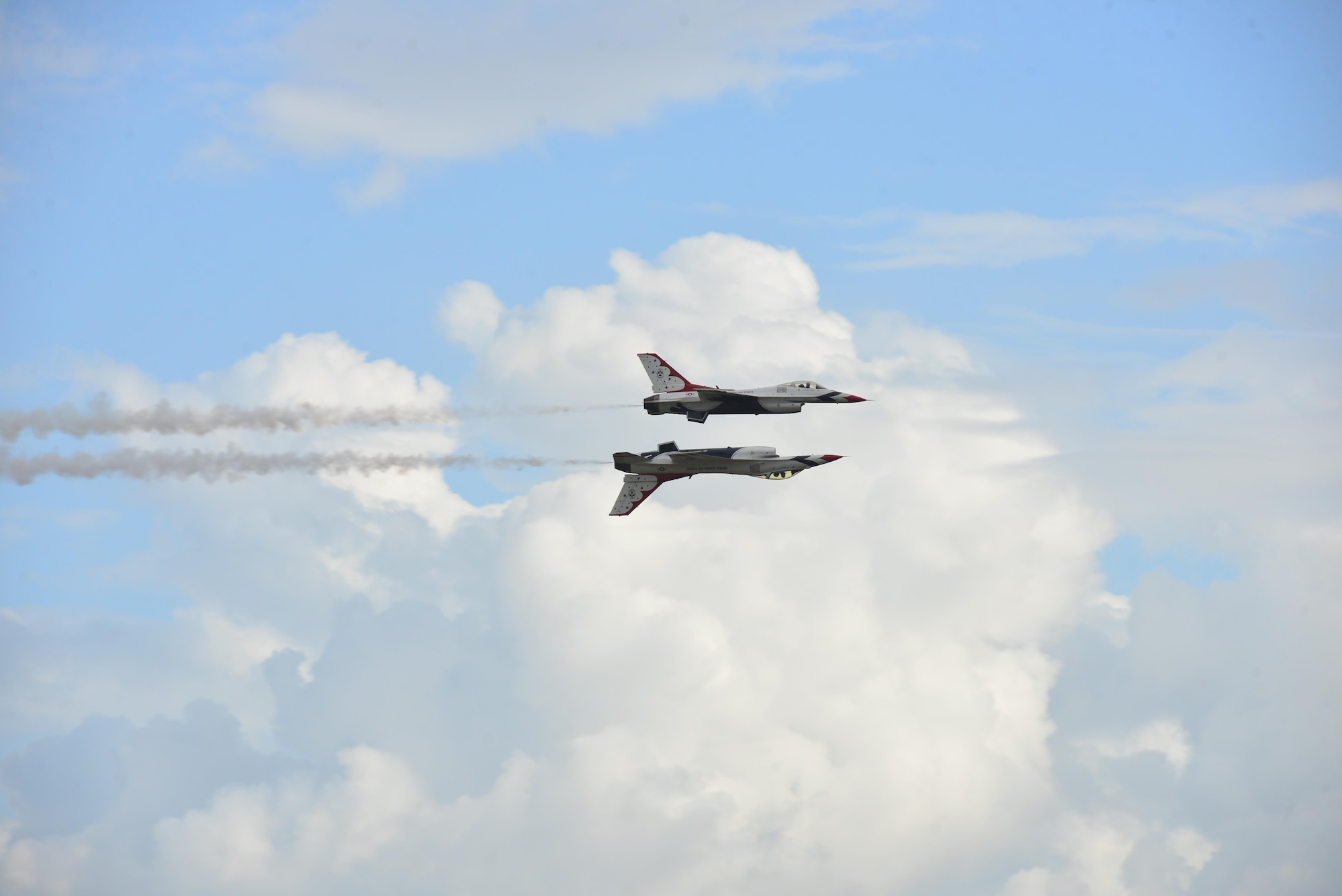 Two U.S. Air Force Thunderbirds perform an aerial maneuver called the "opposing knife edge pass" during the Wings over Homestead air show at Homestead Air Reserve Base, Fla., Nov. 6, 2016. The Thunderbirds hail from Nellis Air Force Base, Nevada, and their purpose is to perform at different air shows across the country. (U.S. Air Force photo by Tech. Sgt. Robert Gibson)