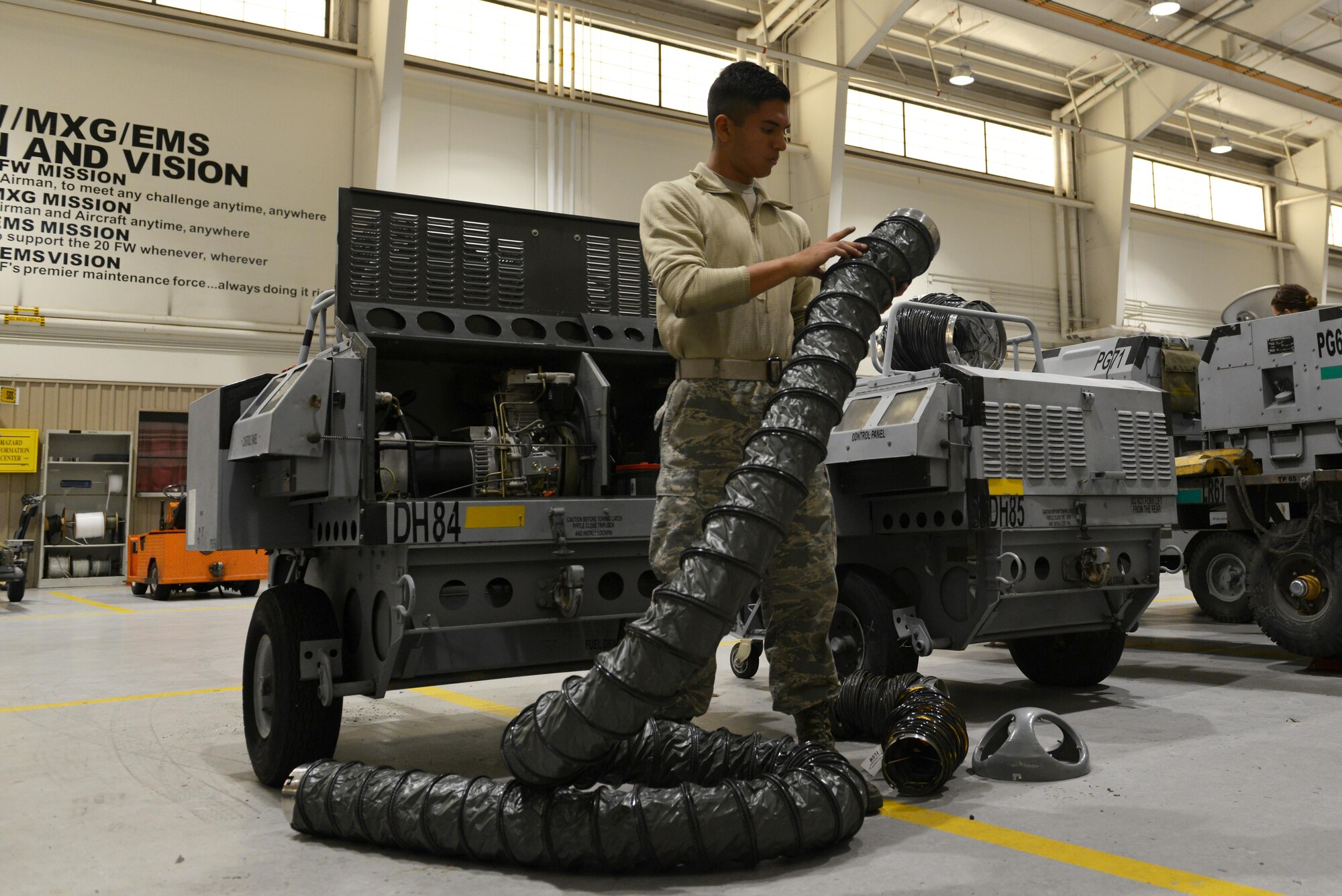 U.S. Air Force Airman Rosendo Lucio, 20th Equipment Maintenance Squadron aerospace ground equipment apprentice, inspects an exhaust air duct for damage at Shaw Air Force Base, S.C., Nov. 2, 2016. Exhaust air ducts are used on new generation heaters, which supply heat to remotely stationed personnel for use in various tasks. (U.S. Air Force photo by Airman 1st Class Destinee Sweeney)