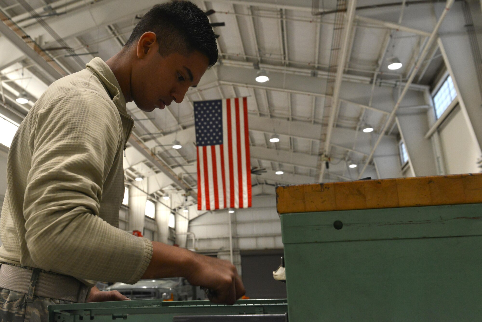 U.S. Air Force Airman Rosendo Lucio, 20th Equipment Maintenance Squadron aerospace ground equipment apprentice, looks through a toolbox for a wrench at Shaw Air Force Base, S.C., Nov. 2, 2016. The 20th EMS AGE flight maintains approximately 35 types of equipment used to keep the 20th Fighter Wing’s F-16CM Fighting Falcons fit to fight. (U.S. Air Force photo by Airman 1st Class Destinee Sweeney)
