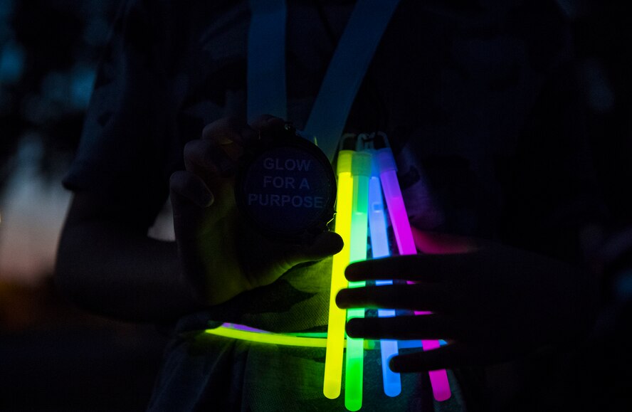 A runner holds up his medal after completing the Glow for a Purpose run, Nov. 8, 2016, at Moody Air Force Base, Ga. The run gave participants the opportunity to run for any cause they personally identified with and wanted to raise awareness for. (U.S. Air Force photo by Airman 1st Class Janiqua P. Robinson)