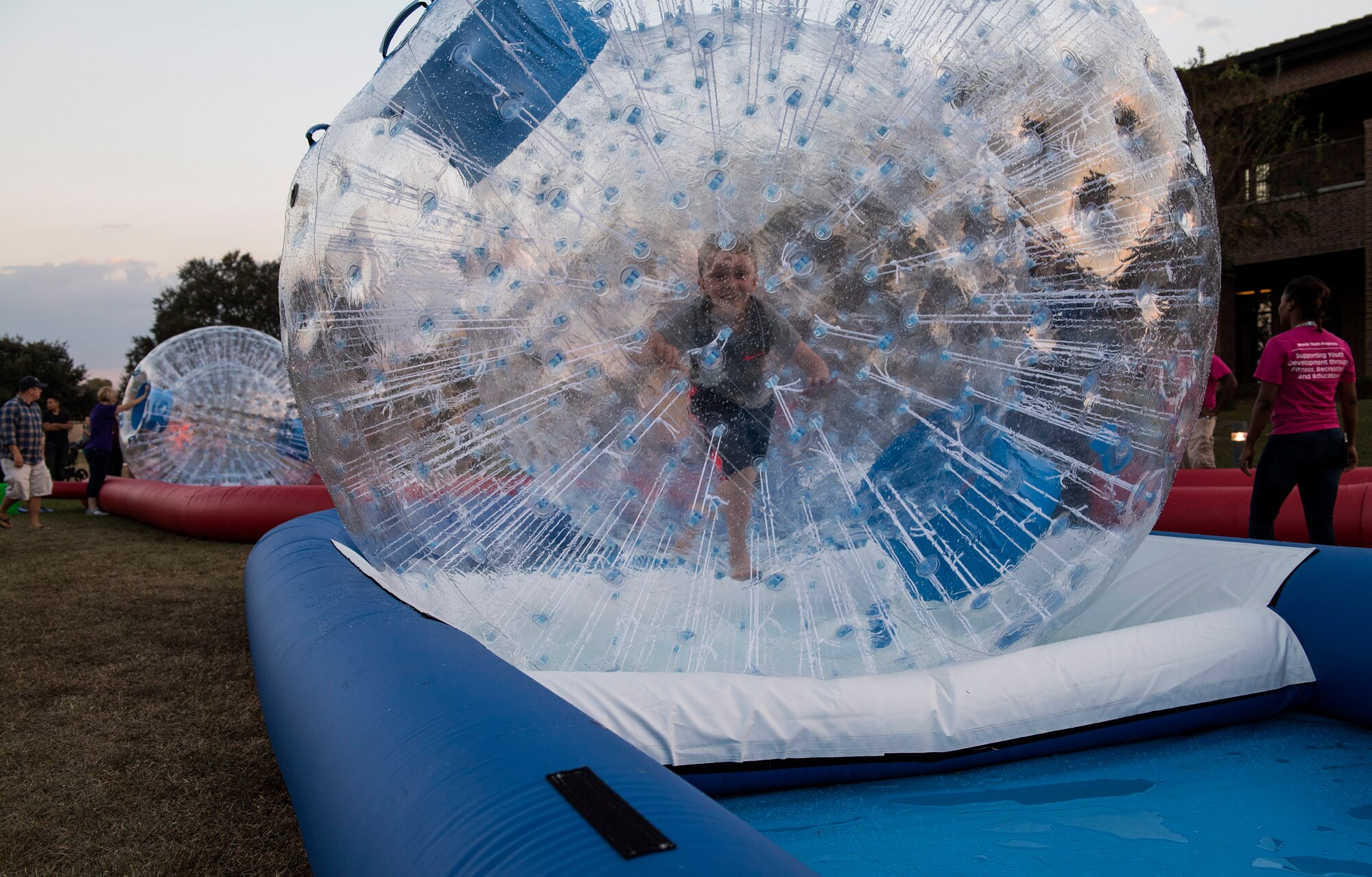 A child rolls in a human hamster ball, Nov. 8, 2016, at Moody Air Force Base, Ga. Moody Fest hosted a plethora of activities designed to bring families together for a great time. (U.S. Air Force photo by Airman 1st Class Janiqua P. Robinson)