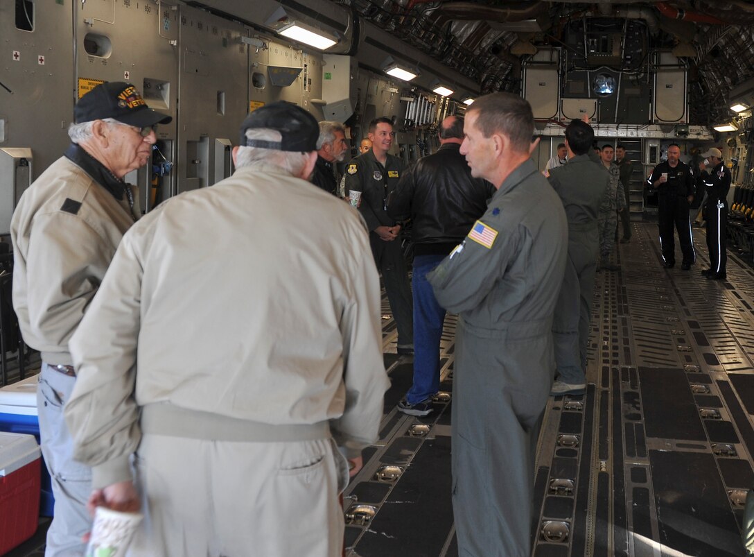U.S. Air force and local civilian pilots gather for Joint Base Charleston’s first Mid-Air Collision Avoidance event in the back of a C-17 Globemaster III Nov. 5, 2016. The MACA program is designed to promote aviation safety between military and civilian pilots who share the local airspace. Sharing the mission of JB Charleston with community civilian pilots offers a better understanding of why specific procedures are put in place. The event gives pilots, military and civilian, a forum to discuss flying and aviation safety. 