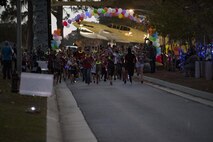 Airmen and their families begin a ‘Glow for a Purpose’ run, Nov. 4, 2016, at Moody Air Force Base, Ga. Moody Fest offered a family friendly environment for people of all ages. (U.S. Air Force photo by Airman 1st Class Daniel Snider)