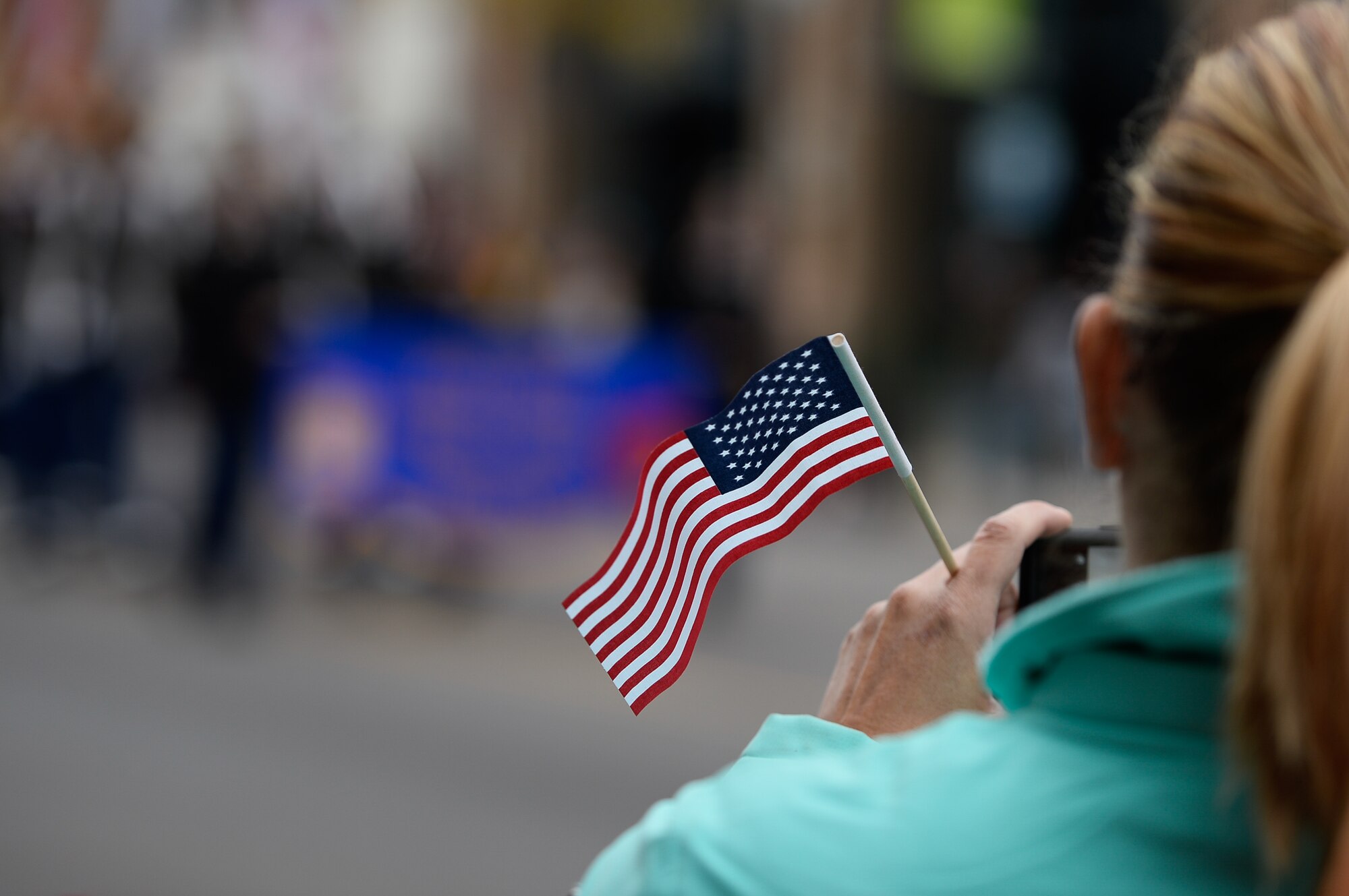 An American Flag waves in the wind during the Colorado Springs Veteran’s Day Parade in Colorado Springs, Colorado, Saturday, Nov. 5, 2016. Onlookers witnessed a procession of veterans from a myriad of different wars, spanning generations. (U.S. Air Force/Christopher DeWitt)