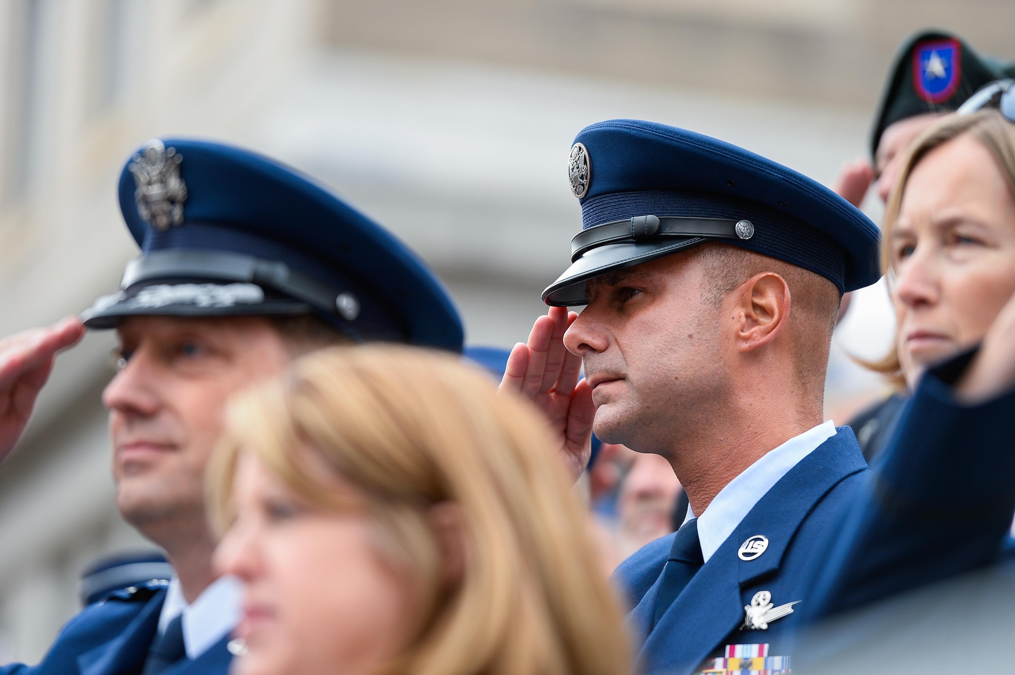 Chief Master Sgt. John Bentivegna, 50th Space Wing command chief, salutes a procession of veterans during the Colorado Springs Veteran’s Day Parade in Colorado Springs, Colorado, Saturday, Nov. 5, 2016. SAFB base leadership both marched in and watched the annual community event. (U.S. Air Force photo/Christopher DeWitt)