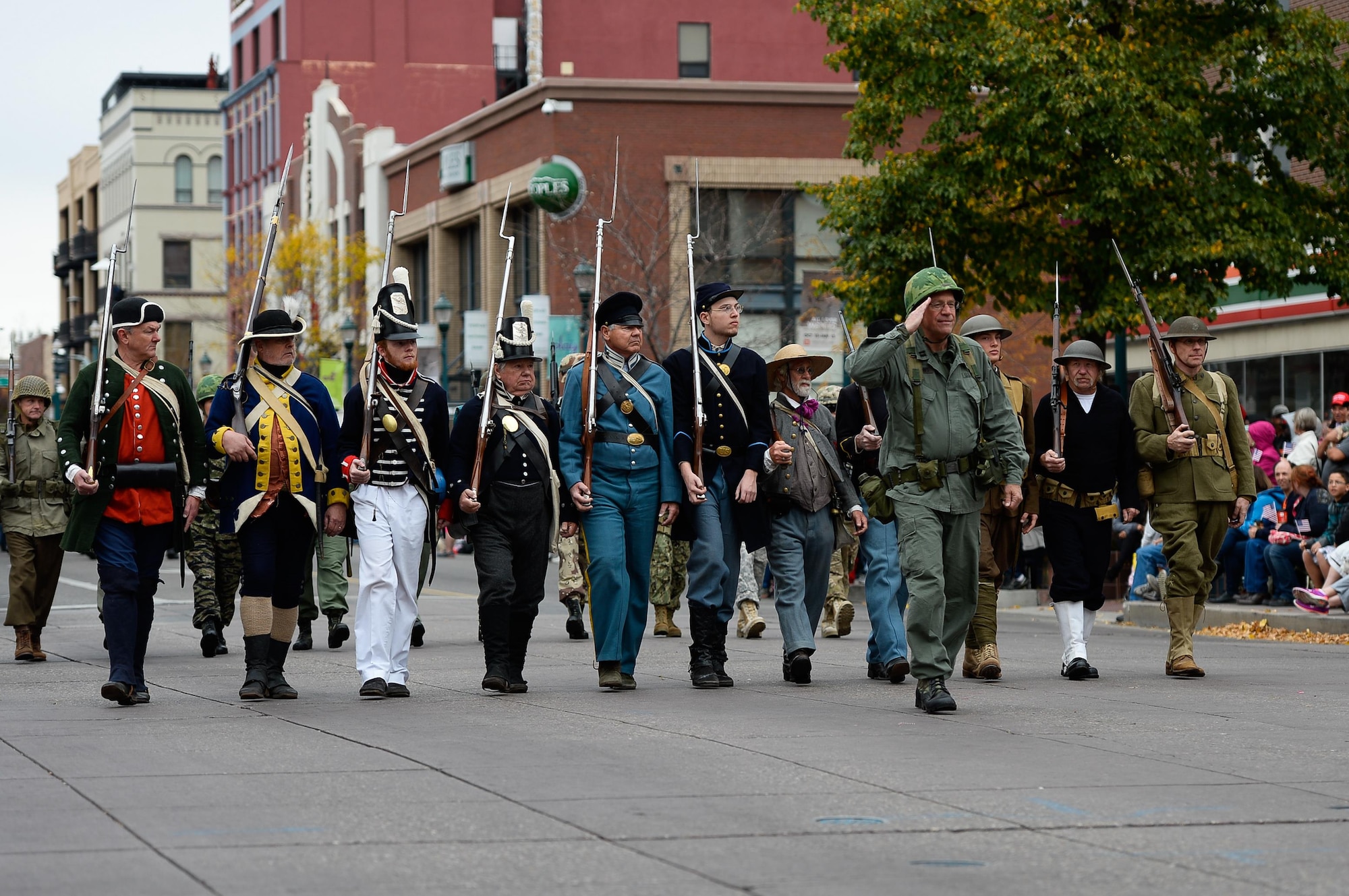 Parade participants march in a variety of service uniforms during the Colorado Springs Veteran’s Day Parade in Colorado Springs, Colorado, Saturday, Nov. 5, 2016. Historic uniforms were worn as a tribute to service members of the past. (U.S. Air Force photo/Christopher DeWitt)