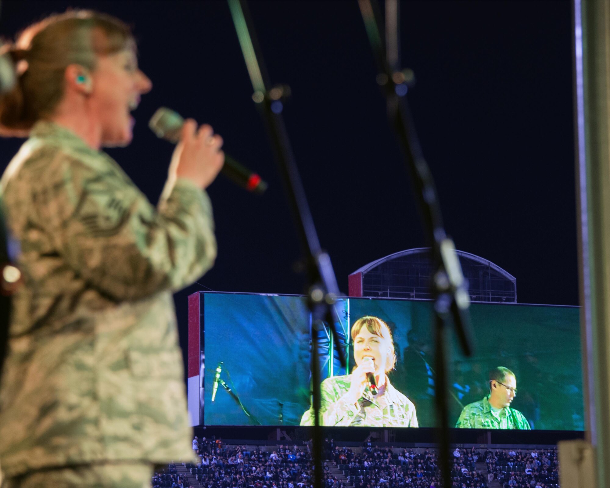 Master Sgt. Paula Goetz, Air Force Band of the Golden West, performs during the halftime show of the Oakland Raiders versus Denver Broncos game at the Oakland Coliseum in Oakland Calif., Nov. 6, 2016. The band is stationed at Travis Air Force Base, Calif., and performed to a live audience of more than 54,000 fans. The band’s performing groups advance Air Mobility Command and global Air Force missions by providing professional musical products and services for official military, recruiting and community relations events. (U.S. Air Force photo/Louis Briscese)