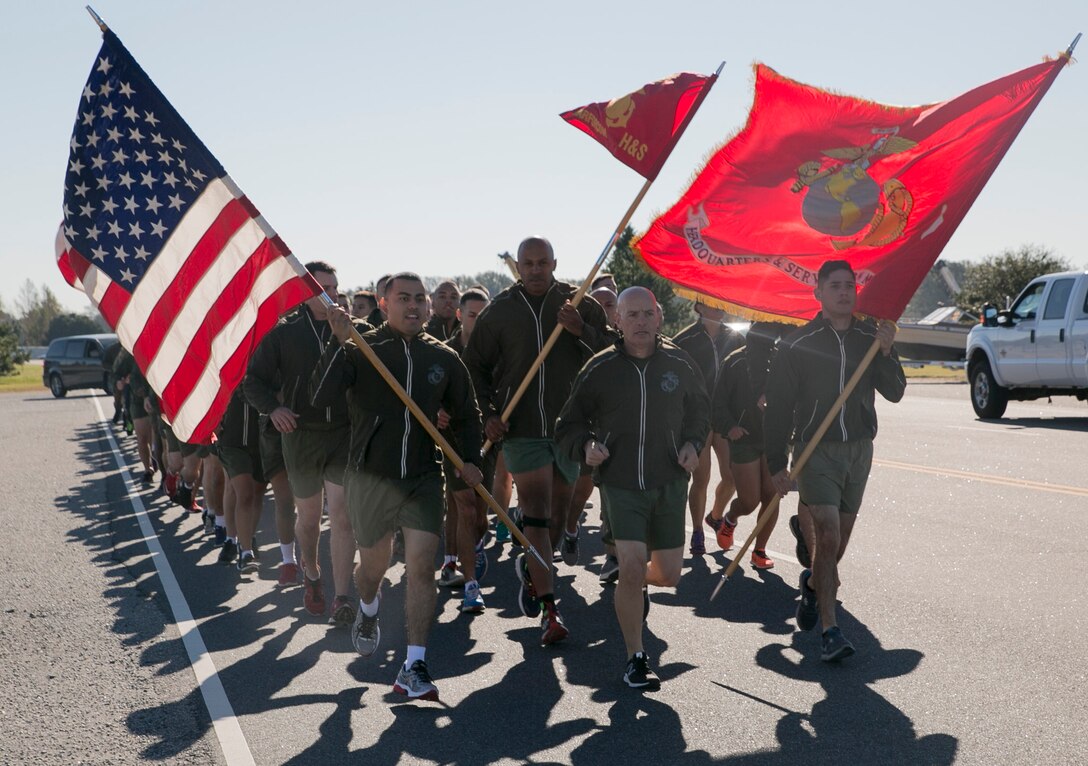 Col. Charles Dunne, commanding officer, Headquarters and Service Battalion, U.S. Marine Corps Forces Command, leads MARFORCOM Marines, sailors and civilians during a three-mile run in honor of the Marine Corps’ 241st birthday on Nov. 8, aboard Naval Station Norfolk. Marines yelled cadence throughout the run along the station’s pier and received a t-shirt and refreshments after the run. (Official U.S. Marine Corps photo by Sgt. Kayla D. Rivera/ Released)