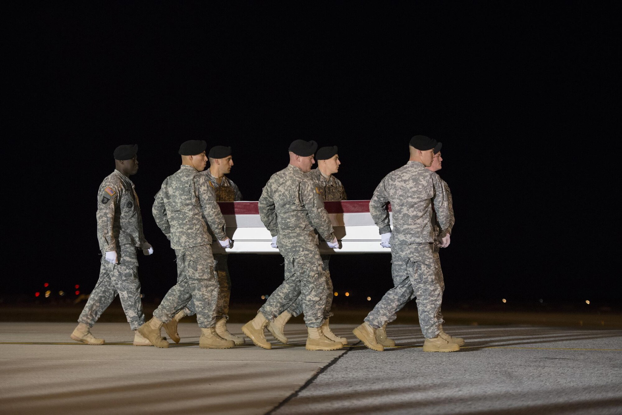 A U.S. Army carry team transfers the remains of U.S. Army Staff Sgt. Kevin J. McEnroe, 30, of Tucson, Ariz., Nov. 7, 2016, at Dover Air Force Base, Del. McEnroe was assigned to the 5th Special Forces Group (Airborne), Fort Campbell, Ky. (U.S. Air Force Photo by Senior Airman Aaron J. Jenne)