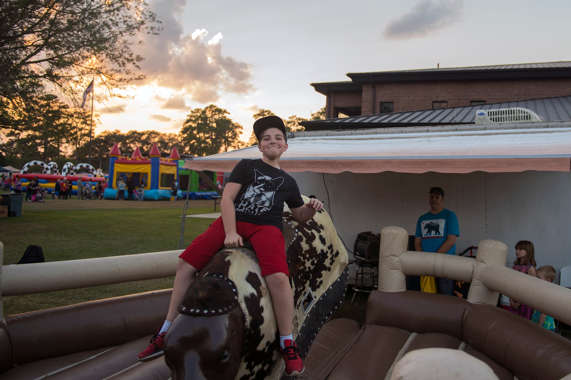 Dylan O’Neal, son of Tech. Sgt. Brian O’Neal, 23d Equipment Maintenance Squadron rides a mechanical bull during Moody Fest, Nov. 4, 2016, at Moody Air Force Base, Ga. Team Moody personnel and their families and loved ones had the chance to enjoy the free event with activities such as a glow run, rock climbing and a country music concert. (U.S. Air Force photo by Airman 1st Class Greg Nash)