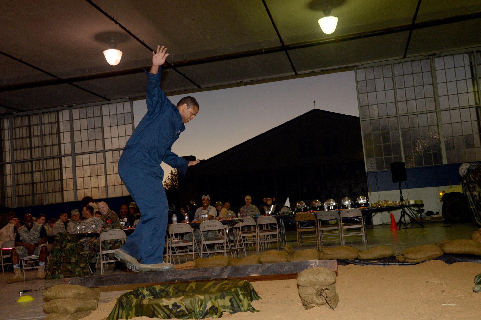 A Maxwell Combat Dining-In attendee maintains his balance while maneuvering though an obstacle course during the event, Nov. 4, 2016, Maxwell Air Force Base, Ala. The remainder of the obstacle course included low crawling and jump roping. (U.S. Air Force photo/ Senior Airman Alexa Culbert)

