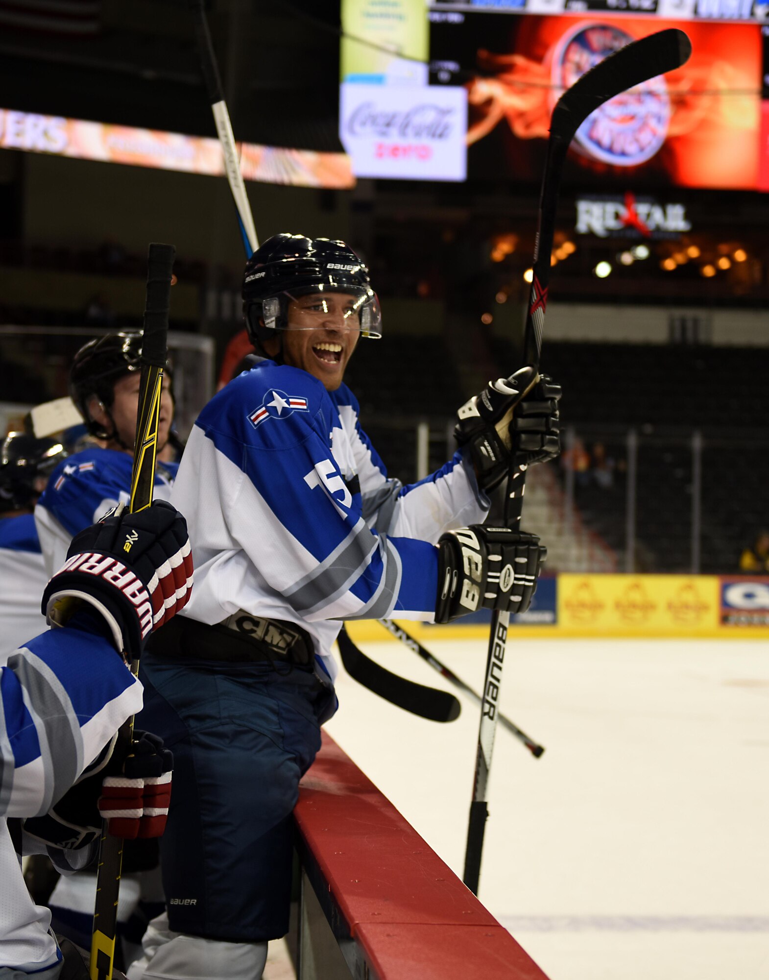 Staff Sgt. Kyle Rodgers, a Fairchild Falcons hockey player, cheers for his side during a scrimmage game at the Spokane Arena Nov. 5, 2016, Spokane, Wash. The Falcons hockey team serves as a group where members of Fairchild can build camaraderie and make new friends. (U.S. Air Force photo/Airman 1st Class Sean Campbell)
