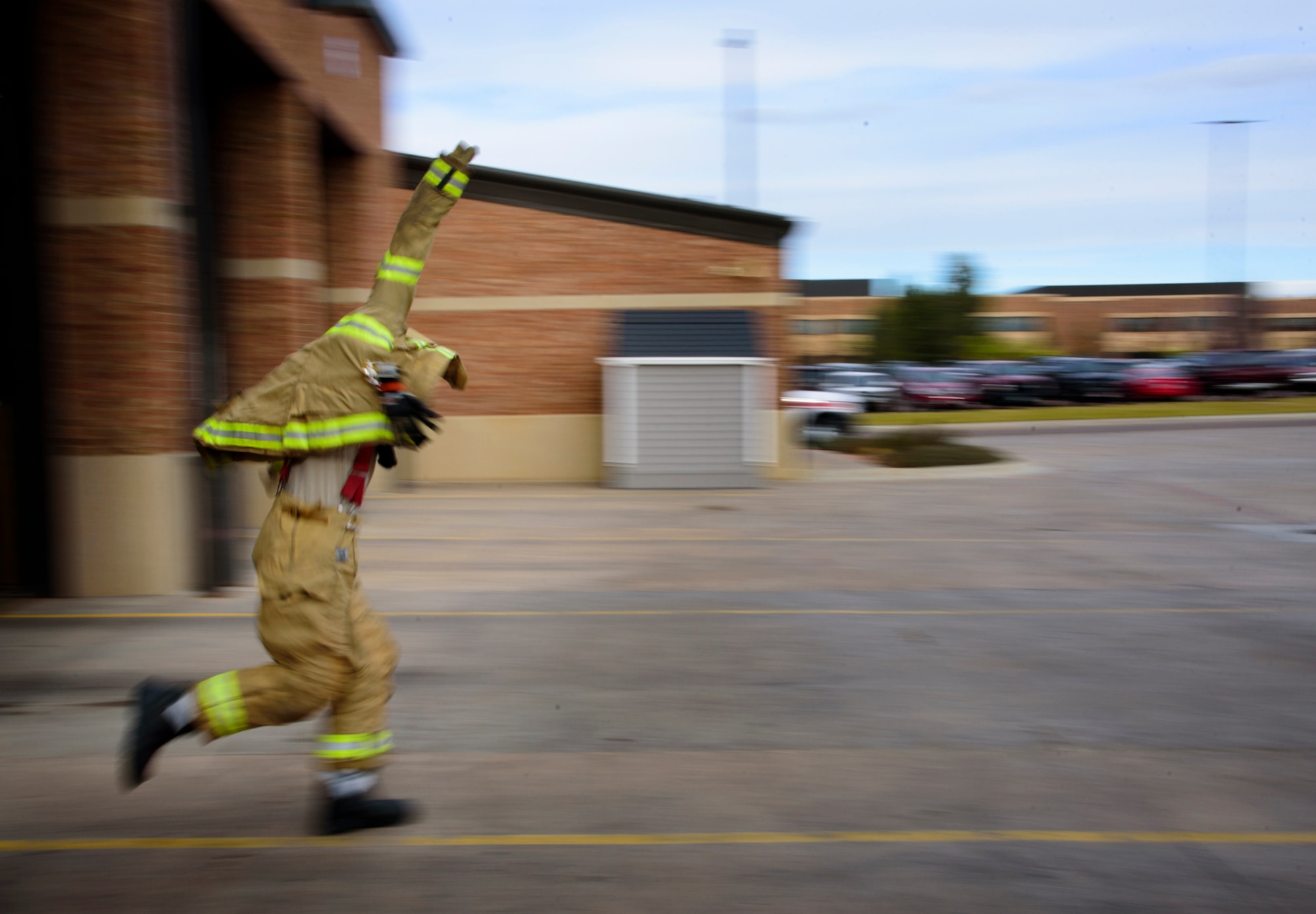PETERSON AIR FORCE BASE, Colo. – A fireman assigned to the Peterson Air Force Base Fire Department races to catch the fire engine after a call comes in during Condor Crest at Peterson AFB, Colo., Nov. 2, 2016. Condor Crest is a wing-wide exercise used to evaluate crisis response at Peterson AFB. (U.S. Air Force photo by Airman 1st Class Dennis Hoffman)