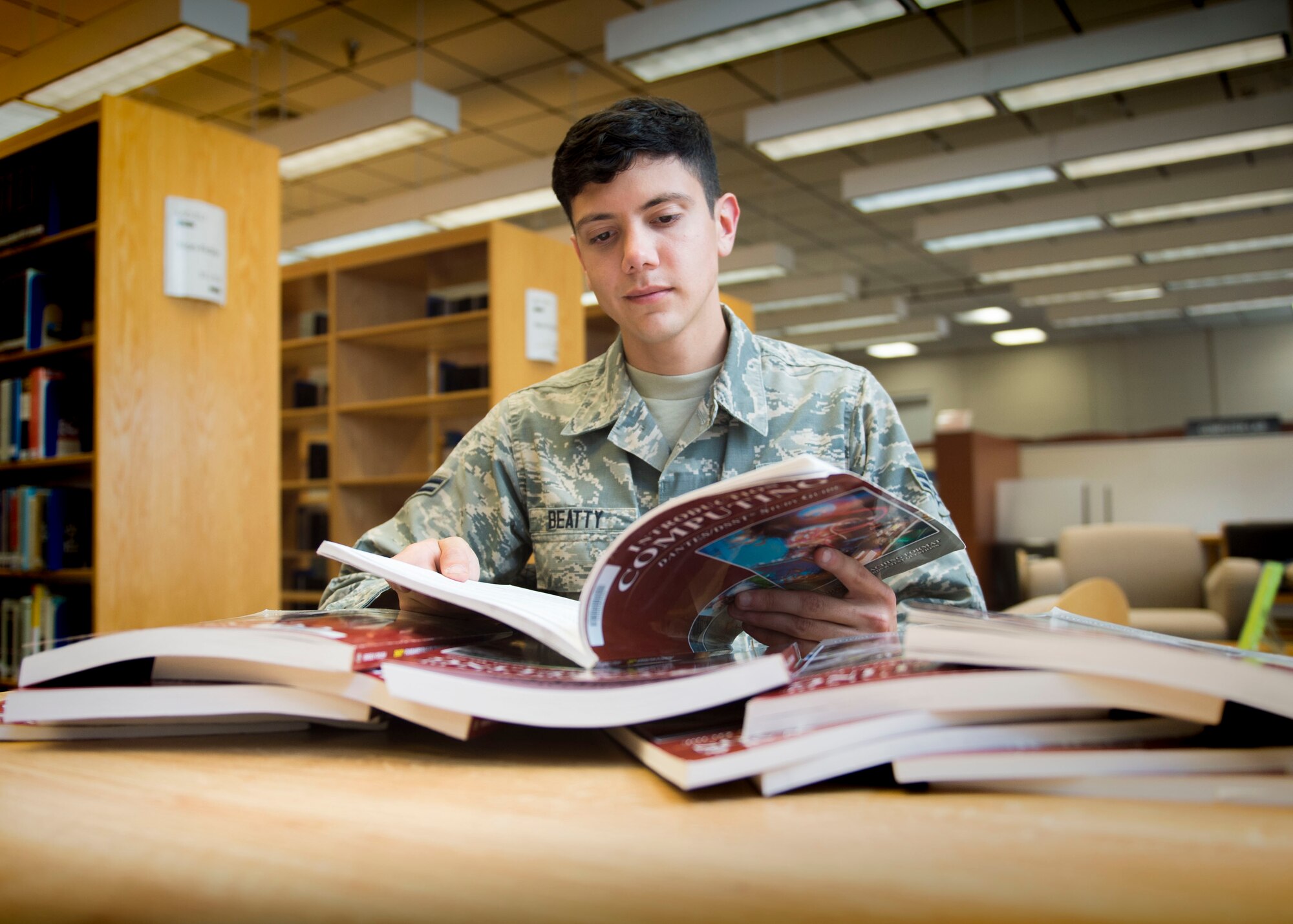 Airman 1st Class Phillip Beatty, a crew chief with the 901st Special Operations Aircraft Maintenance Squadron, won an in-squadron Defense Activity for Non-Traditional Education Support (DANTES) Subject Standardized Tests and College Level Examination Program contest during the month of October. The 901st SOAMXS offered the Airman who could pass the most tests a two-day pass for their accomplishments. (U.S. Air Force photo by Senior Airman Krystal M. Garrett) 