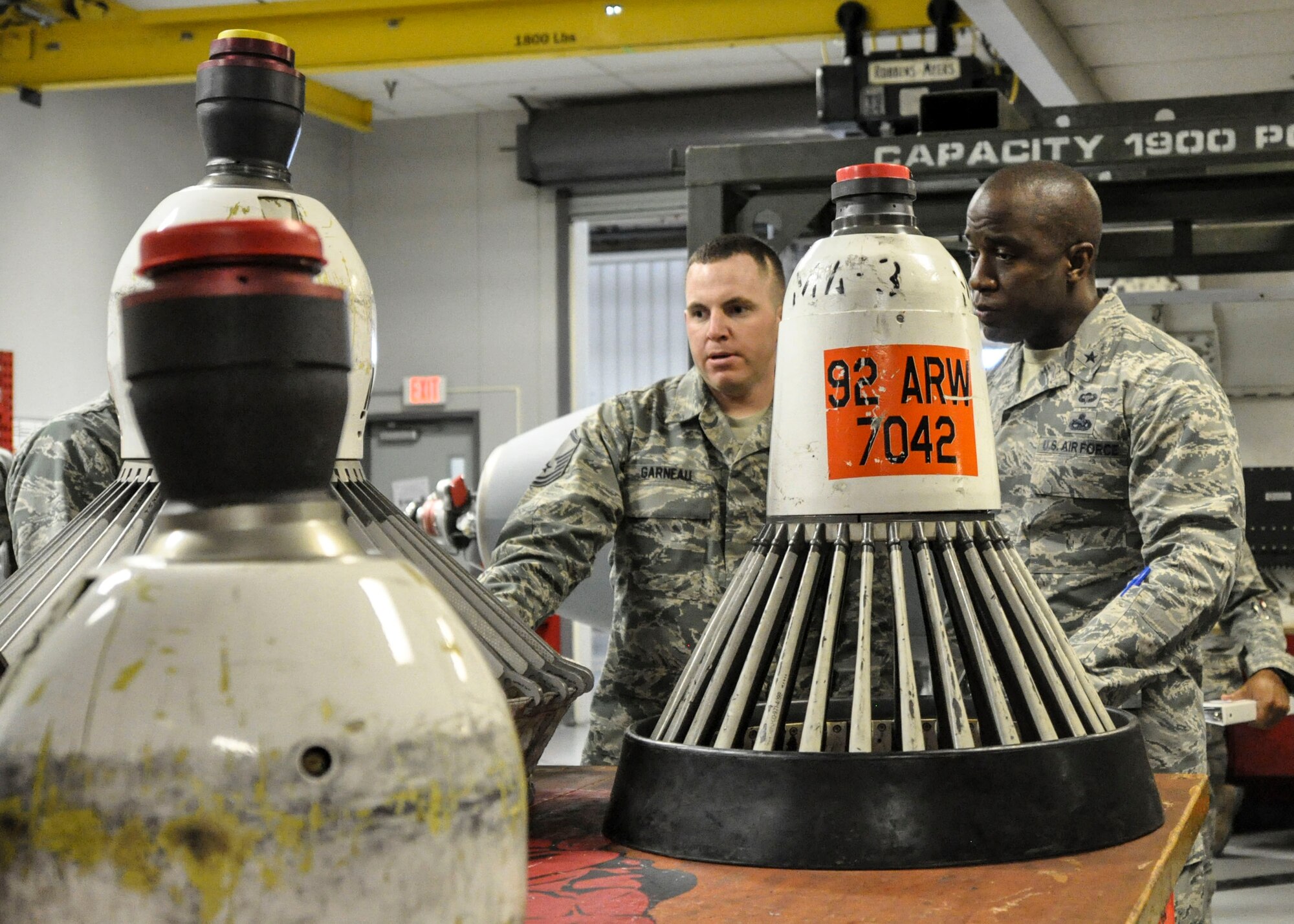 Master Sgt. Dustin Garneau, 92nd Maintenance Squadron NCO in charge of aircraft hydraulics, shows Brig. Gen. Stacey Hawkins, boom pod baskets during a base tour Nov. 7, 2016, at Fairchild Air Force Base, Wash. Hawkins, who is the Air Mobility Command director of logistics, engineering and force protection, spoke with Airmen around the base to see what their needs were, so he could plan to assist them at the AMC level. (U.S. Air Force photo/Airman 1st Class Taylor Shelton)