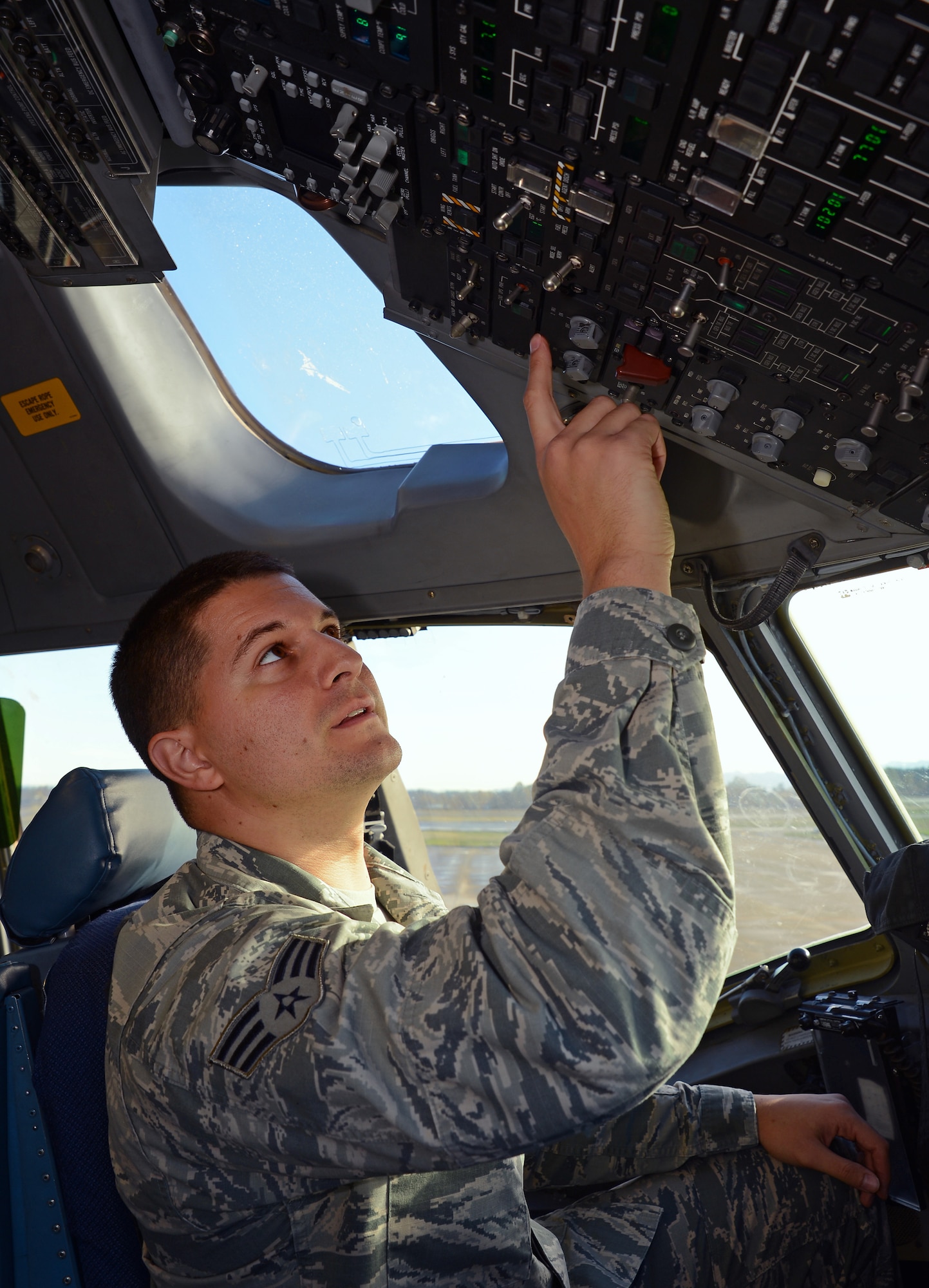 Senior Airman Jamal Agoun, 62nd Aircraft Maintenance Squadron instrument and flight control systems apprentice, troubleshoots the flight controls of a C-17 Globemaster III aircraft Nov. 3, 2016, at Joint Base Lewis-McChord, Wash. Agoun recently discovered a faulty C-17 heads up display assembly control panel saving the Air Force more than $390,000. (U.S. Air Force photo/Senior Airman Jacob Jimenez)  