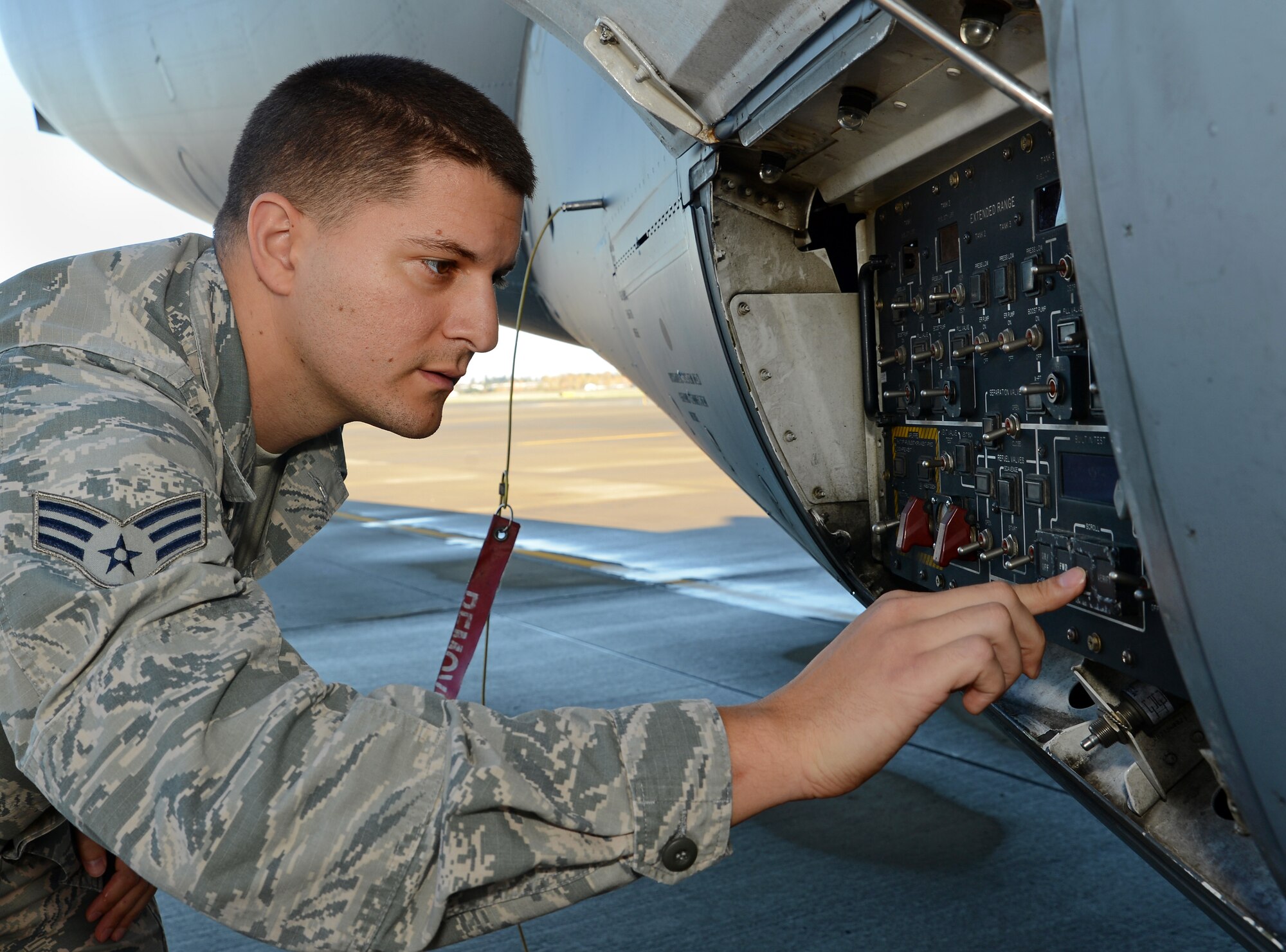 Senior Airman Jamal Agoun, 62nd Aircraft Maintenance Squadron instrument and flight control systems apprentice, inspects refuel panel on a C-17 Globemaster III aircraft Nov. 3, 2016, at Joint Base Lewis-McChord, Wash. Agoun was recognized by his supervision for identifying and resolving an engine start problem on a C-17. (U.S. Air Force photo/Senior Airman Jacob Jimenez) 