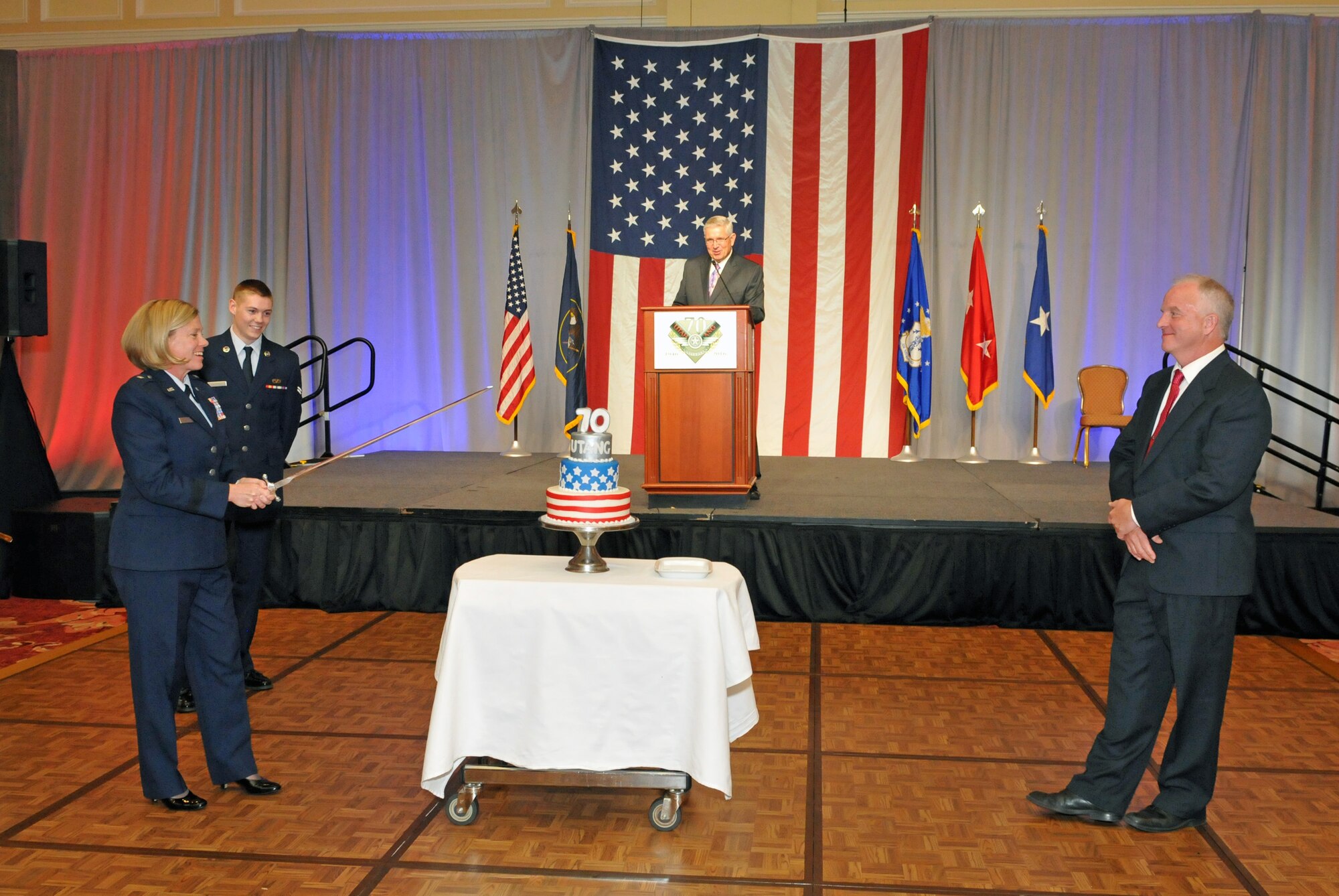 Brig. Gen. Christine Burckle, Utah Air National Guard Commander, prepares to cut the cake at the Utah Air National Guard 70th Anniversary Gala on Nov. 4, 2016, at The Grand America Hotel in Salt Lake City. More than 450 military and civilian guests attended the event hosted by the Utah Air Force Association. (U.S. Air National Guard photo by Staff Sgt. Annie Edwards)