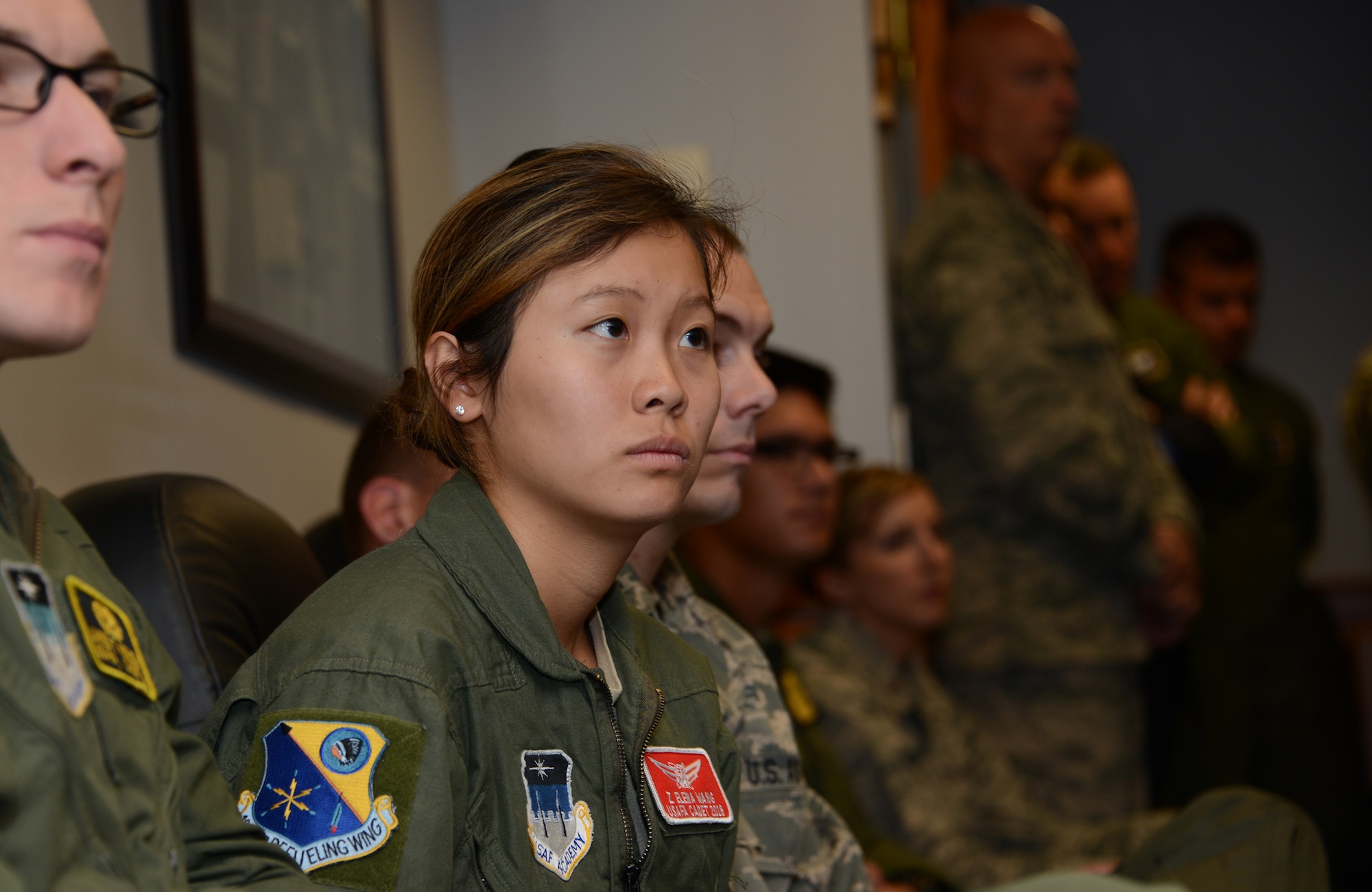 Cadet 2nd Class, Elena Wang from the United States Air Force Academy, listens to a briefing from Air National Guard Director Lt. Gen. Scott Rice during a visit to the 185th Air Refueling Wing, Iowa National Guard in Sioux City, Iowa on November 5, 2016. 
 U.S. Air National Guard photo by Master Sgt. Vincent De Groot 185 ARW PA