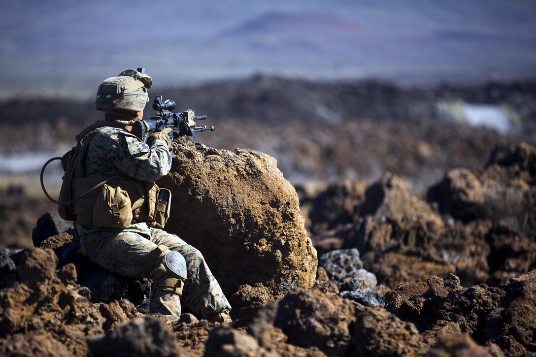 A U.S. Marine assigned to Alpha Company, 1st Battalion 3rd Marine Regiment post security during a company assault on Training Area 17, during Lava Viper 17.1, aboard the Pohakuloa Training Area, on the big island of Hawaii, Nov. 2, 2016. Lava Viper is an annual combined arms training exercise that integrates ground elements such as infantry and logistics, with indirect fire from artillery units as well as air support from the aviation element. (U.S. Marine Corps photo by Cpl. Ricky S. Gomez)