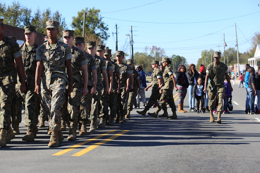 Marines march during the 96th annual Veterans Day Parade in Warsaw, N.C., Nov. 5, 2016. The Warsaw Veterans Day Parade is the official Veterans Parade in the state of North Carolina. The Marines are assigned to Combat Logistics Battalion 2. Marine Corps photo by Cpl. Shannon Kroening