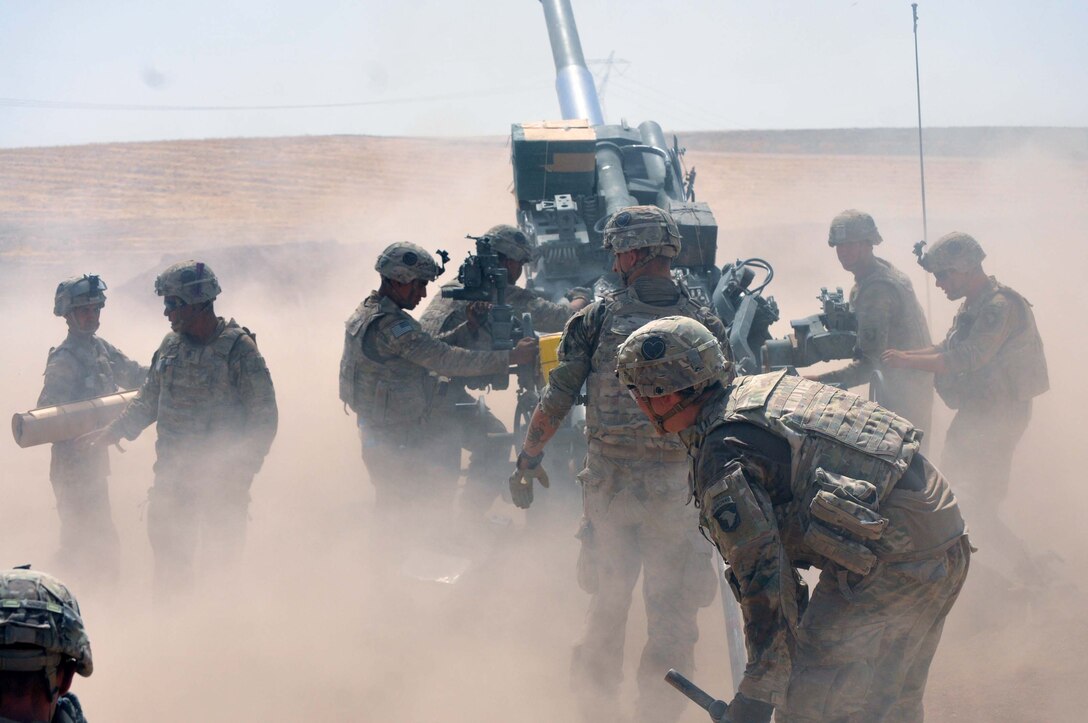 In this file photo taken Aug. 15, 2016, U.S Army Soldiers, Battery C, 1st Battalion, 320th Field Artillery Regiment, Task Force Strike, begin their crew drill to load another round for a fire mission in northern Iraq. The 526th Brigade Support Battalion’s Support Operations Cell and the 336th Combat Support Sustainment battalion’s movement control team in Erbil have sustained operations like this one which are critical to defeat the Islamic State of Iraq and the Levant. (U.S. Army photo by 1st Lt. Daniel I Johnson)