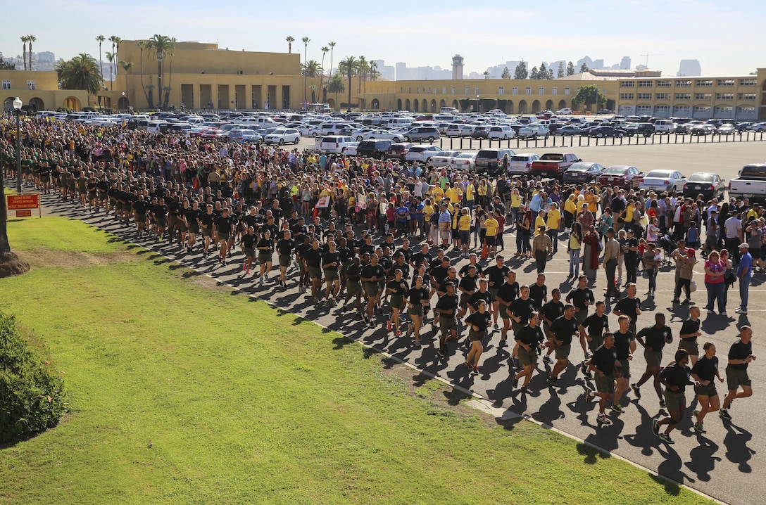 Marines with Headquarters and Service Battalion run in formation behind the new Marines of Hotel Company, 2nd Recruit Training Battalion, during a motivational run at Marine Corps Recruit Depot San Diego, Nov. 8. The run was in celebration of the Marine Corps’ 241st birthday, which is Nov. 10, 1775. Annually, more than 17,000 males recruited from the Western Recruiting Region are trained at MCRD San Diego. Hotel Company is scheduled to graduate Nov. 9.