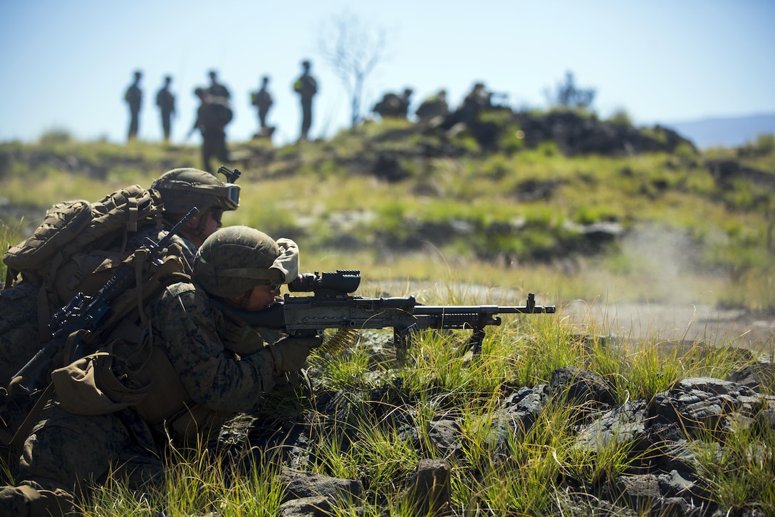 A U.S. Marine assigned to Alpha Company, 1st Battalion 3rd Marine Regiment provides cover fire during a company assault on Training Area 17, part of Lava Viper 17.1, aboard the Pohakuloa Training Area, on the big island of Hawaii, Nov. 2, 2016. Lava Viper is an annual combined arms training exercise that integrates ground elements such as infantry and logistics, with indirect fire from artillery units as well as air support from the aviation element. (U.S. Marine Corps photo by Cpl. Ricky S. Gomez)