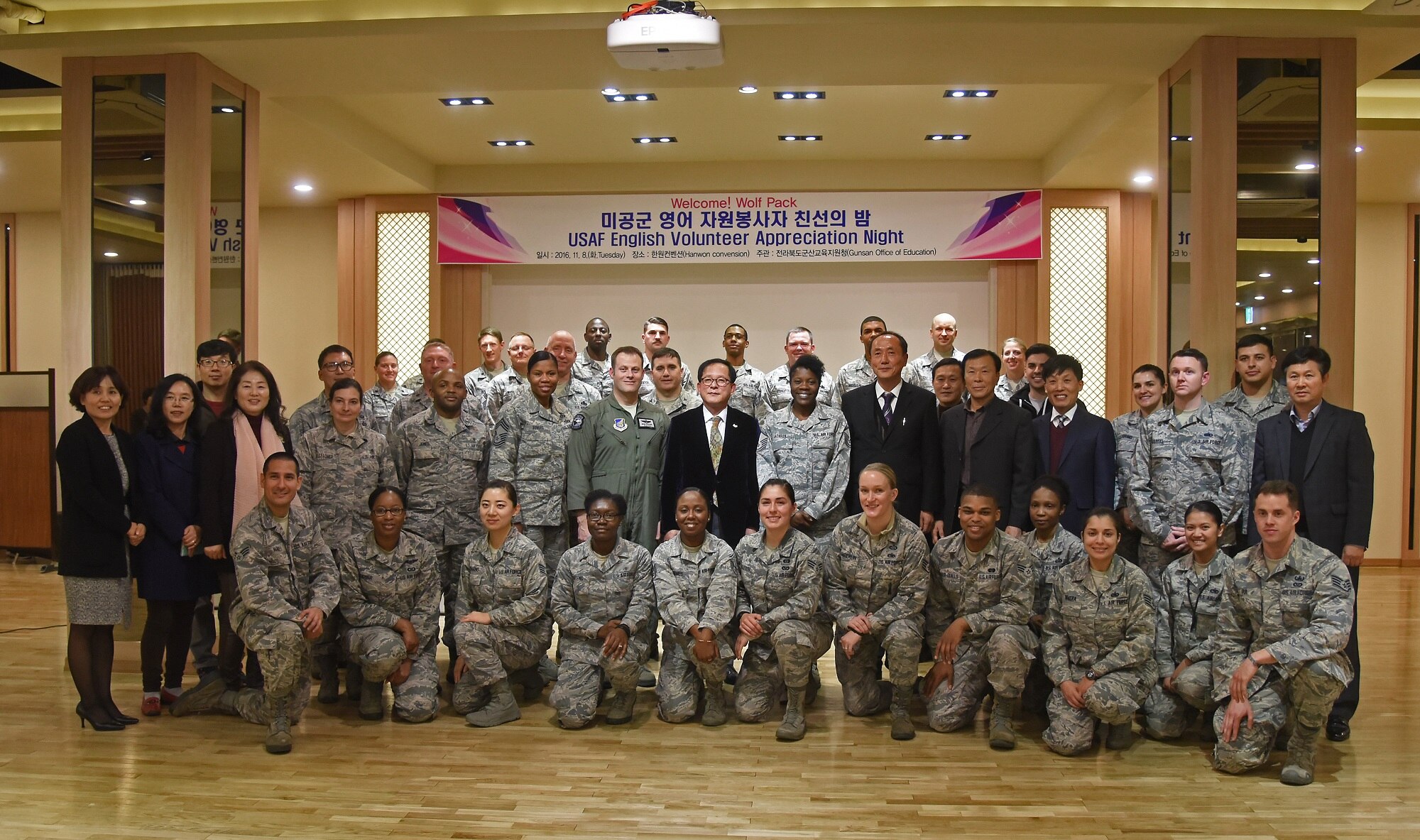 Airmen from the 8th Fighter Wing are recognized during a volunteer appreciation night at the Hanwon Convention room in the city of Gunsan, Republic of Korea, Nov. 8, 2016. Each of the volunteers taught English to students from 36 different schools in Gunsan. The students involved in the program also attended the appreciation night and were able to sit with their respective teachers. (U.S. Air Force photo by Tech. Sgt. Jeff Andrejcik/Released)
