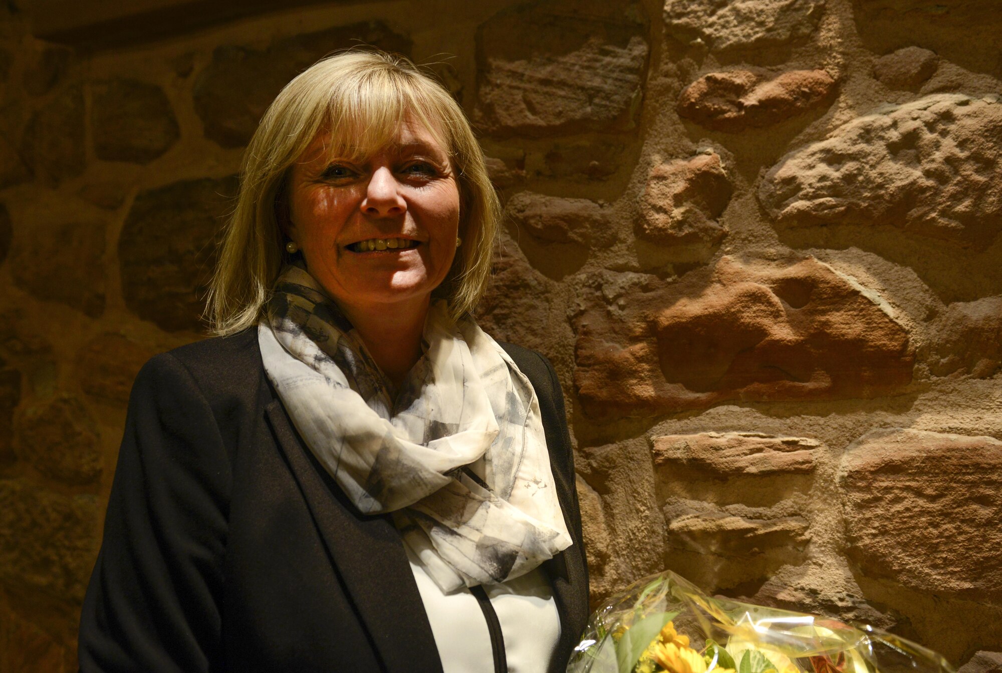 Petra Lessoing, 86th Airlift Wing Public Affairs specialist, is recognized during the 2016 German-American Day celebration in Landstuhl, Germany Nov. 5, 2016. Lessoing was celebrated for her commitment to the German-American friendship as she has worked on Ramstein for more than 32 years. (U.S. Air Force photo/TSgt Sara Keller)