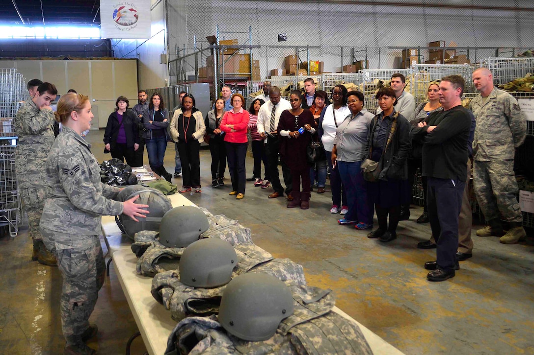 Airmen from the 87th Logistics Readiness Squadron explain how they issue gear to deploying service members during DLA Troop Support’s visit to Joint Base McGuire-Dix-Lakehurst, New Jersey Nov. 2. More than 100 employees participated in Troop Support Academy, a three-day course that provides a big-picture perspective of how the agency supports its customers.