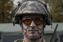 Senior Airman David DeSantis, 1st Combat Communications Squadron radio transmission systems technician, participates in exercise Healthy Thunder at Ramstein Air Base, Germany, Nov. 4, 2016. The Airmen put on face paint for the final battle of the field training exercise portion of Healthy Thunder, where opposing forces breached the base and Airmen defended it. (U.S. Air Force photo by Senior Airman Tryphena Mayhugh)