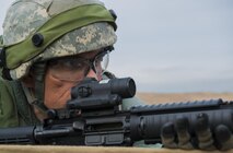 Tech. Sgt. Carlos Duarte, 1st Combat Communications Squadron network infrastructure supervisor, watches an area for opposing forces during exercise Healthy Thunder at Ramstein Air Base, Germany, Nov. 4, 2016. The second portion of Healthy Thunder was a field training exercise where the Airmen defended the base against opposing forces through a variety of scenarios. (U.S. Air Force photo by Senior Airman Tryphena Mayhugh)