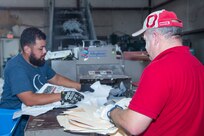 John Perez and Russ LePage, 502nd Civil Engineer Squadron motor vehicle operators, shred paper Nov. 2, 2016, at the Joint Base San Antonio-Lackland Recycling Center. Recycling one ton of paper saves 682.5 gallons of oil, 7000 gallons of water, between 17 and 31 trees, 3.3 cubic yards of landfill space, 4000 kilowatts of energy, and 7000 gallons of water. 