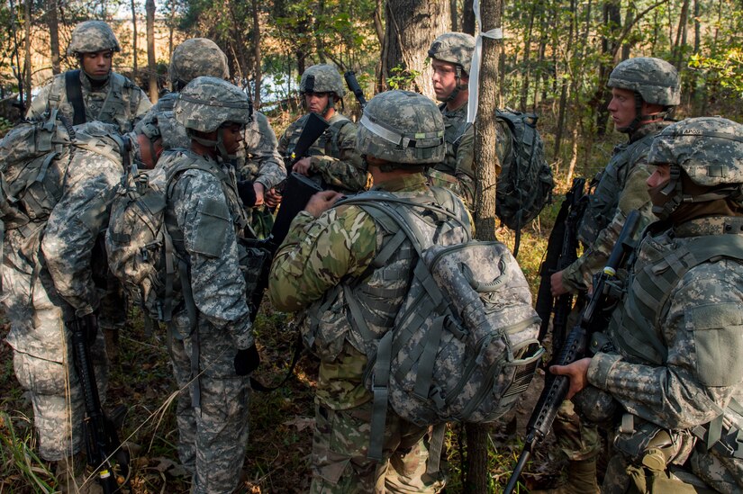 A group of U.S. Army Soldiers assigned to the 1098th Transportation Company, 11th Trans. Battalion, 7th Trans. Brigade (Expeditionary) receive a brief on their next mission during a training exercise at Joint Base Langley-Eustis, Va., Nov. 3, 2016. The Soldiers conducted six missions throughout the day including surviving an ambush, coordinating an ambush and a reconnaissance mission. (U.S. Air Force photo by Airman 1st Class Derek Seifert)