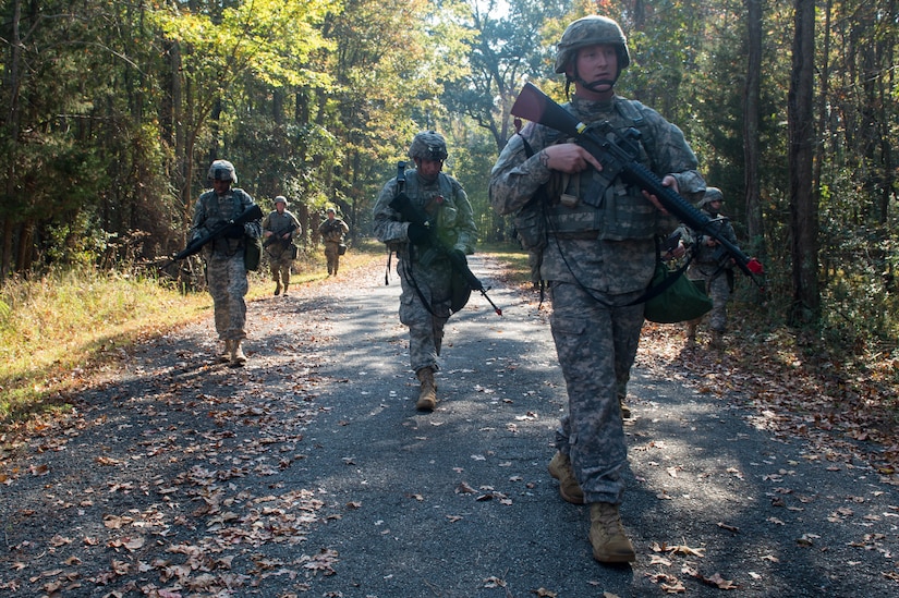 U.S. Army Sgt. Jacob Verstraete, 1098th Transportation Company, 11th Trans. Battalion, 7th Trans. Brigade (Expeditionary) watercraft engineer, leads his platoon to the next objective during a training exercise at Joint Base Langley-Eustis, Va., Nov. 3, 2016. Verstraete took command as platoon leader during this mission in which his Soldiers received orders to find nearby enemies, engage them, then search for possible intelligence. (U.S. Air Force photo by Airman 1st Class Derek Seifert)