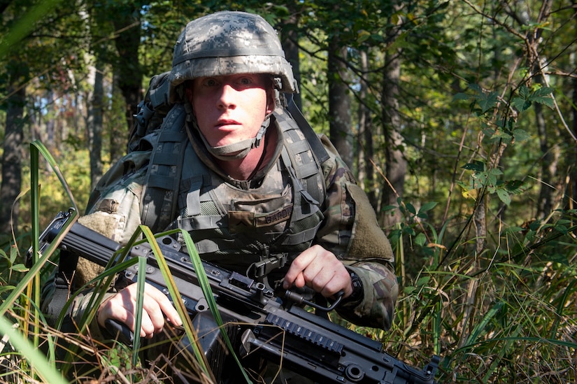 U.S. Army Pvt. Adam Gardner, 1098th Transportation Company, 11th Trans. Battalion, 7th Trans. Brigade (Expeditionary) watercraft operator, watches for enemy movement during a training exercise at Joint Base Langley-Eustis, Va., Nov. 3, 2016. Gardner and his platoon conducted a reconnaissance mission where they gathered information on enemies to provide to headquarters. (U.S. Air Force photo by Airman 1st Class Derek Seifert)