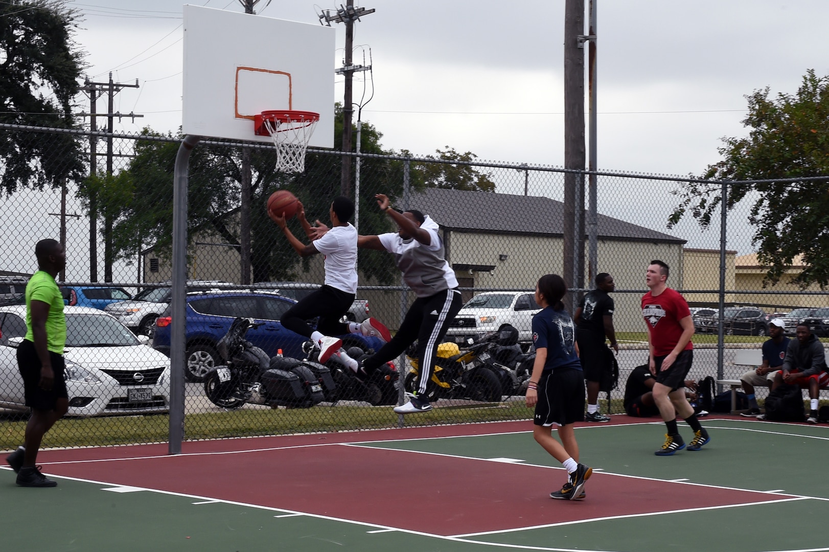 A member of the 959th Medical Group basketball team goes in for a layup against the 59th Medical Operations Group during the Warrior Medic Challenge basketball tournament held Nov. 4 on Joint Base San Antonio-Lackland, Texas. Warrior Medic Challenge pitted active-duty and civilian Airmen from the 59th Medical Wing’s seven groups against each other in friendly rivalry. (U.S. Air Force photo/Staff Sgt. Jason Huddleston)