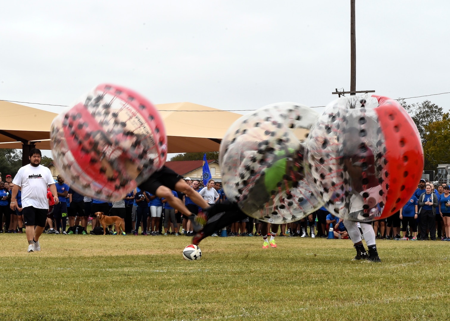 Airmen run into each other during the Knockerball competition on Joint Base San Antonio-Lackland, Texas, Nov. 4. Seven competitors – one from each group – were on the field at a same time trying to get the soccer ball into their group’s goal. (U.S. Air Force photo/Staff Sgt. Kevin Iinuma)