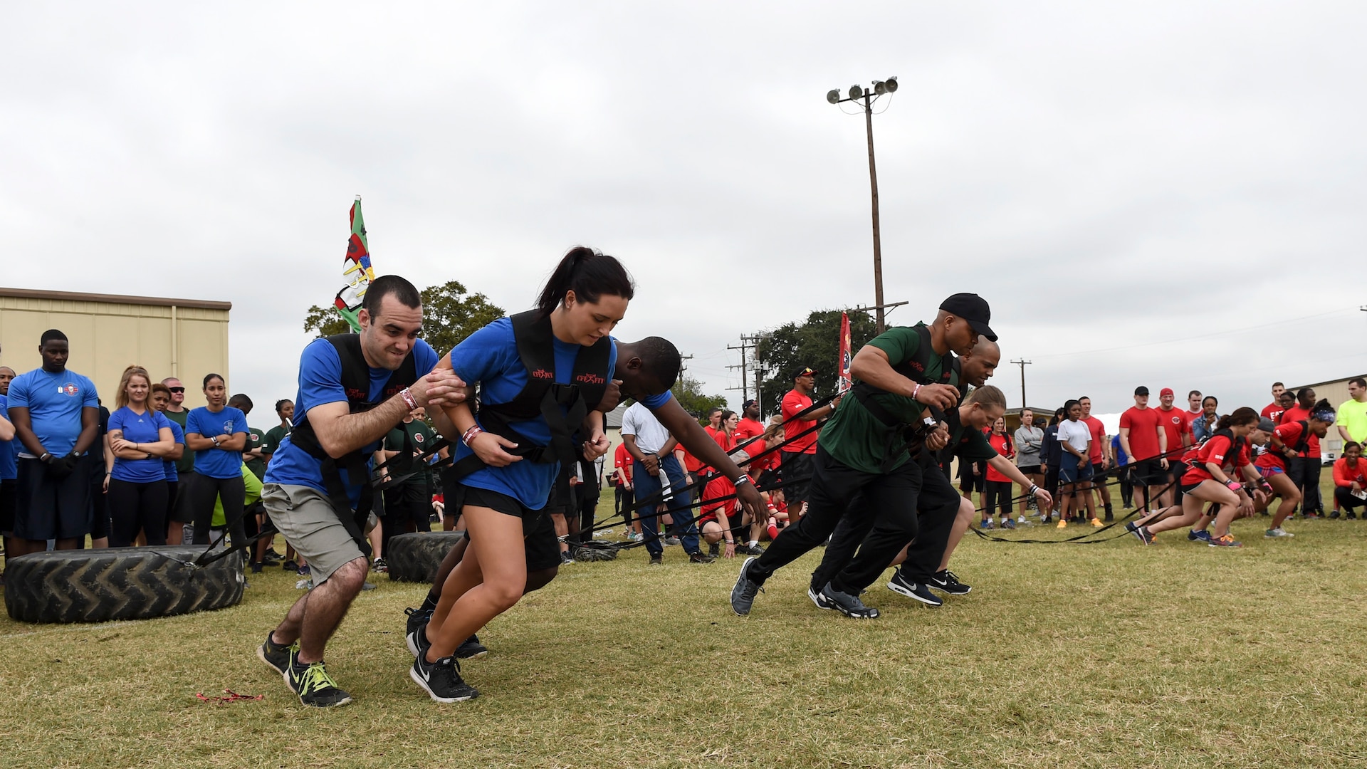 Airmen works in trios to pull a 150-pound tire during the ‘Dragula’ competition at the Warrior Medic Challenge on Joint Base San Antonio-Lackland, Texas, Nov. 4. Airmen from the seven 59th Medical Wing groups dragged the tire a distance of 600 feet. (U.S. Air Force photo/Staff Sgt. Kevin Iinuma)