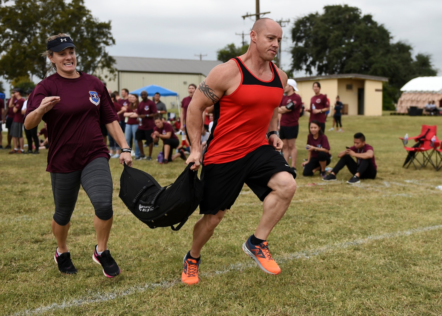 Members of the 359th Medical Group team carry a 100-pound sandbag during the ‘Don’t Sand Bag Me, Bro’ competition Nov. 4 on Joint Base San Antonio-Lackland, Texas, Nov. 4. The event was one of several that made up the 59th Medical Wing’s Warrior Medic Challenge. Competitors carried the sandbag 300 feet, sprinted 1000 feet, and carried the sandbag another 300 feet. (U.S. Air Force photo/Staff Sgt. Kevin Iinuma)