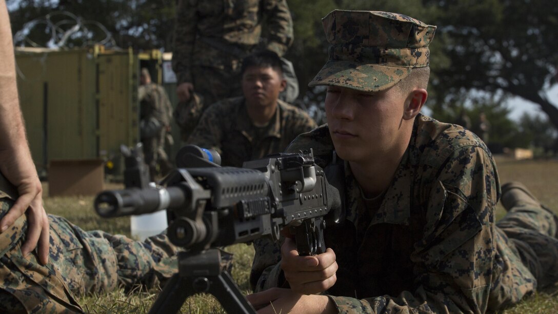 Pfc. Caleb Lebrun, a radio operator with Combat Logistics Battalion 6, listens to an instructor as they review the steps of operating a M240B medium machine gun during a command post exercise at Bogue Marine Corps Auxiliary Landing Field, N.C., Nov. 3, 2016. Marines learned how to operate weapons they might use on deployment as CLB 6 prepares for their Marine Corps Combat Readiness Evaluation.