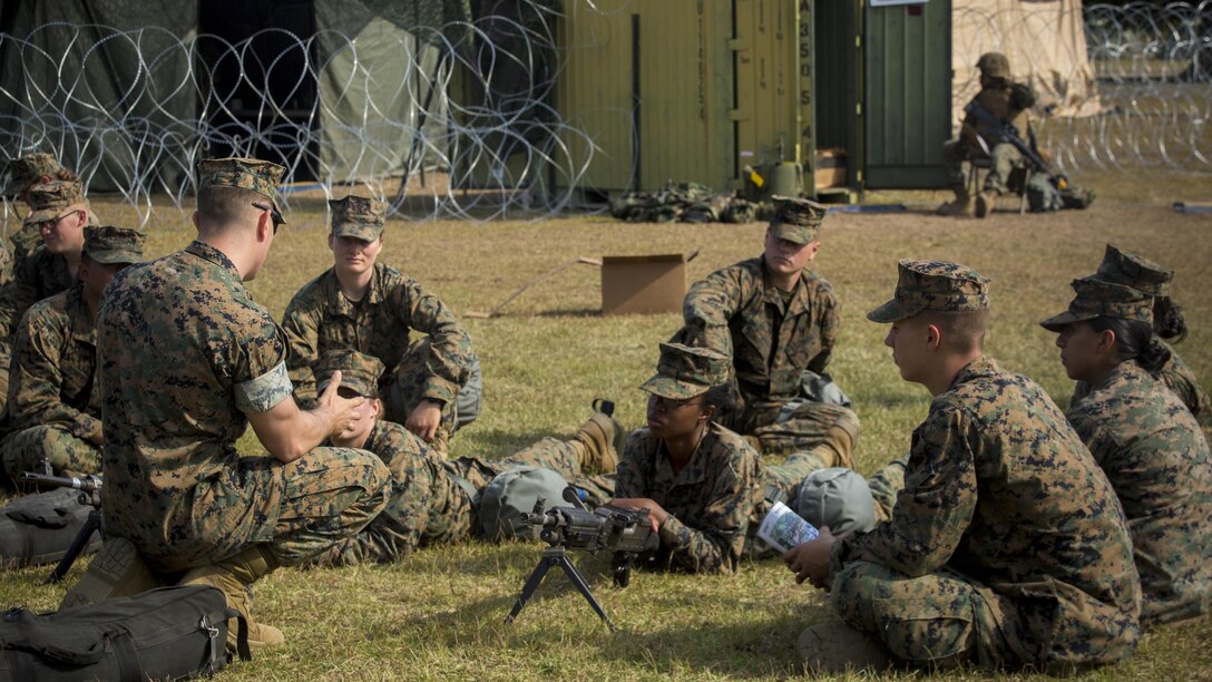 Marines listen to Cpl. Joseph Kruggel as he explains the operation procedures of a M240B machine gun during a command post exercise at Bogue Marine Corps Auxiliary Landing Field, N.C., Nov. 3, 2016. Combat Logistics Battalion 6 conducted the training in preparation for their upcoming deployment Special-Purpose Marine Air Ground Task Force, Crisis Response-Africa. Kruggel serves as a machine gunner with 3rd Battalion, 6th Marine Regiment. The Marines participating in the class are with CLB 6.