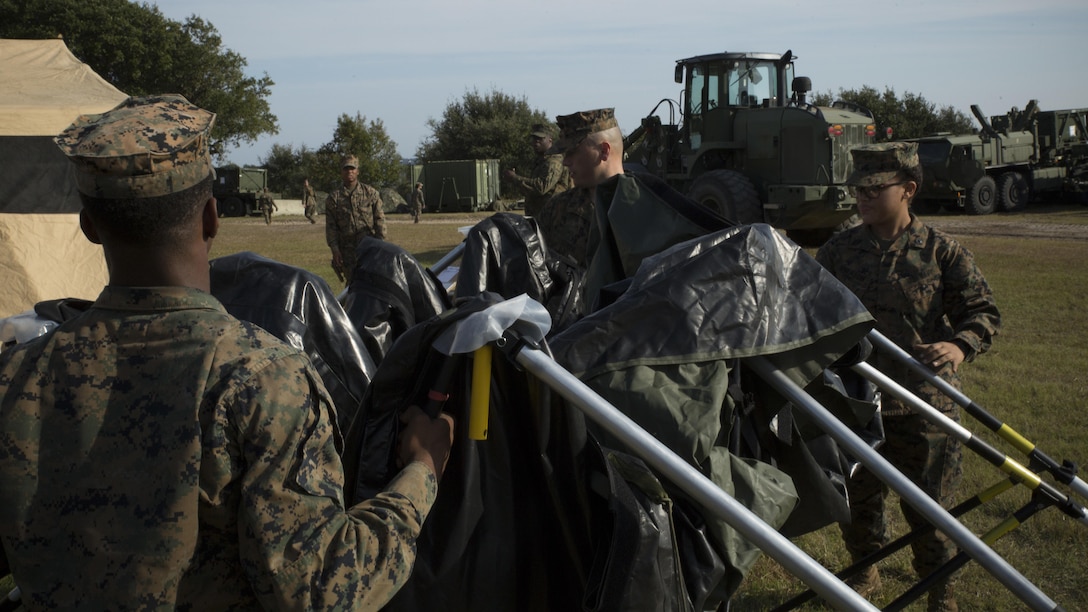 Marines and sailors with Combat Logistics Battalion 6 close a tent to be packed away during a command post exercise at Bogue Marine Corps Auxiliary Landing Field, N.C., Nov. 3, 2016. Combat Logistics Battalion 6 conducted the training in preparation for their Marine Corps Combat Readiness Evaluation.