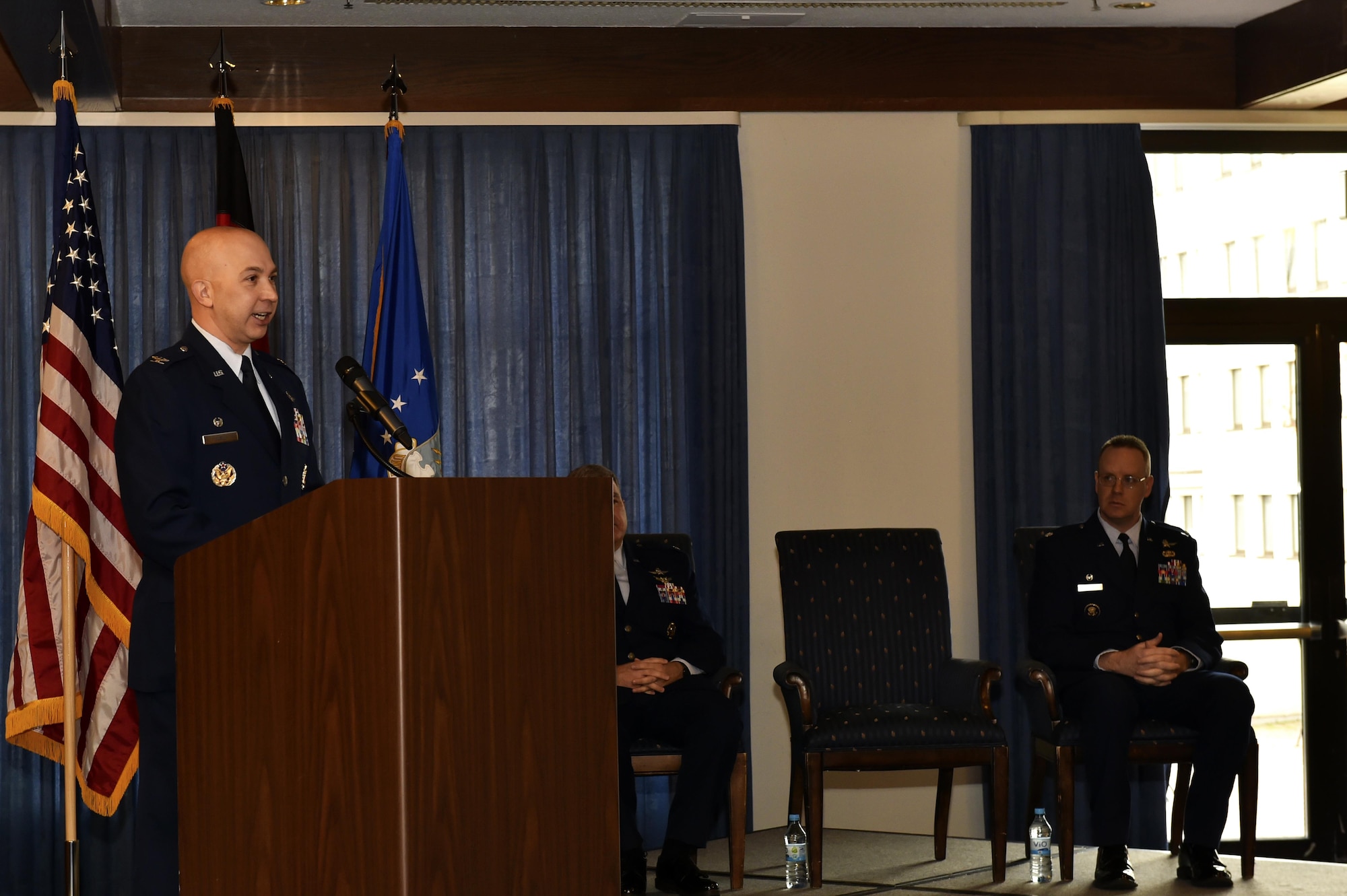 A 786th Force Support Squadron honor guard member places the new guidon for the U.S. Air Force in Europe-Air Forces Africa Air Postal Squadron into a stand during the re-designation ceremony at Ramstein Air Base, Germany, Nov. 9, 2016. The 2nd AIRPS was reassigned, designated, and organized from the 86th Mission Support Group to USAFE-AFAFRICA. (U.S. Air Force photo by Senior Airman Jonathan Bass)